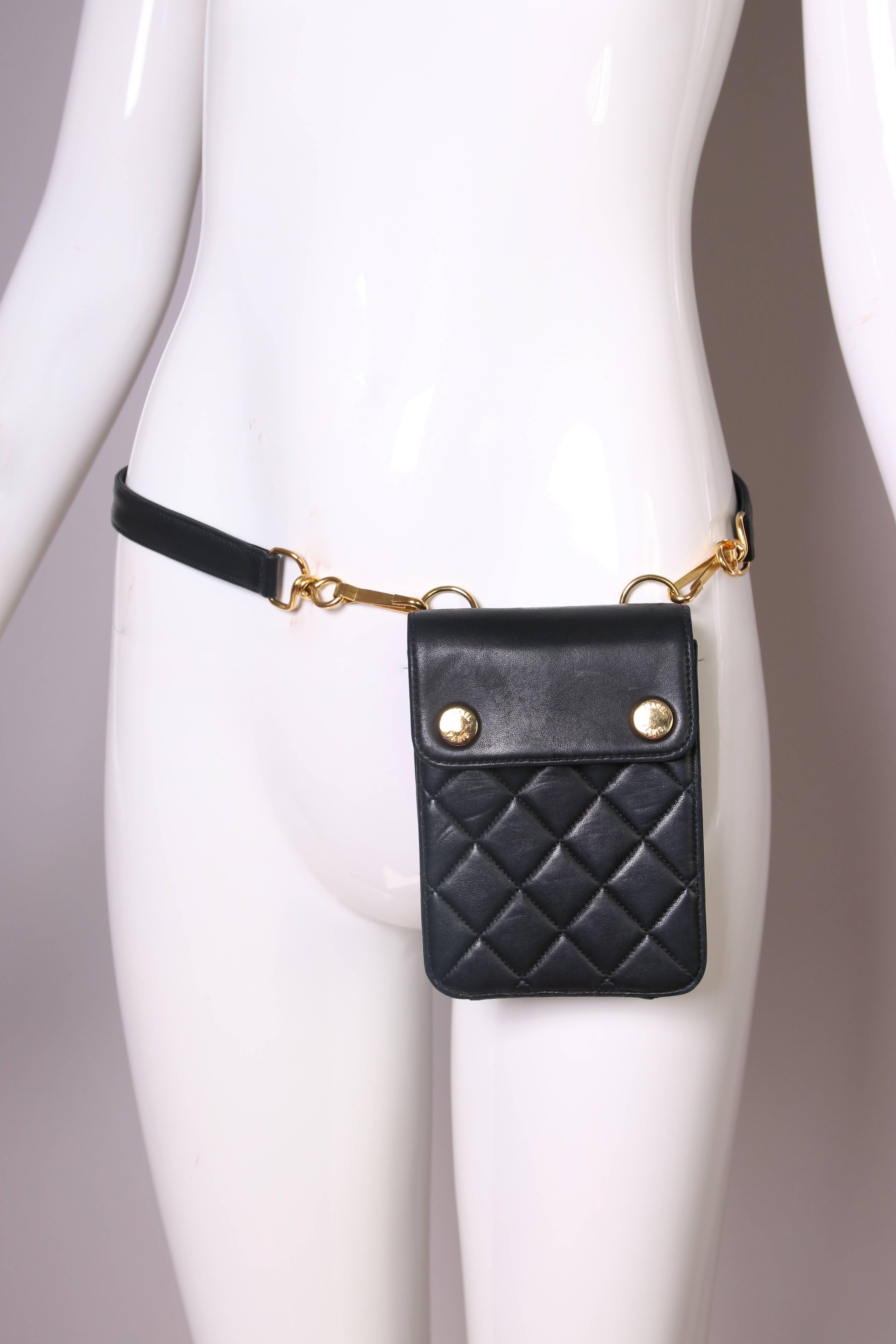Circa 1996/1997 Chanel black quilted leather waist bag with gold hardware. In excellent condition. Strap stamped 80/32 at interior. Has hologram sticker with serial number: 4436366.
MEASUREMENTS:
Bag
Length - 6