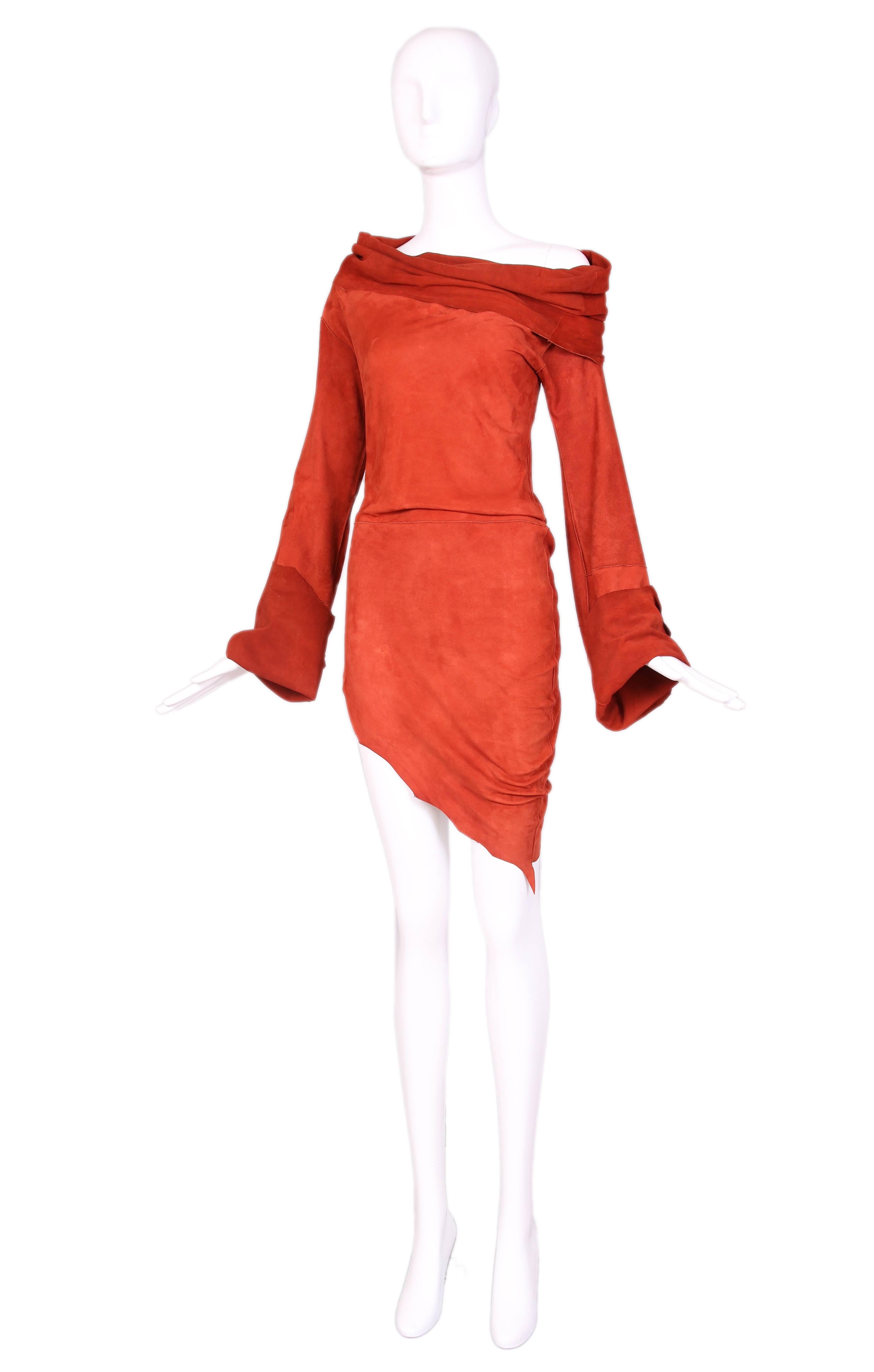Vintage Jean Paul Gaultier burnt orange suede asymmetrical tunic with bell sleeves and over-sized cowl neck that can be worn off the shoulder. Edges of hem and cuffs are hand cut to look uneven. In excellent condition with some minor light, hard to