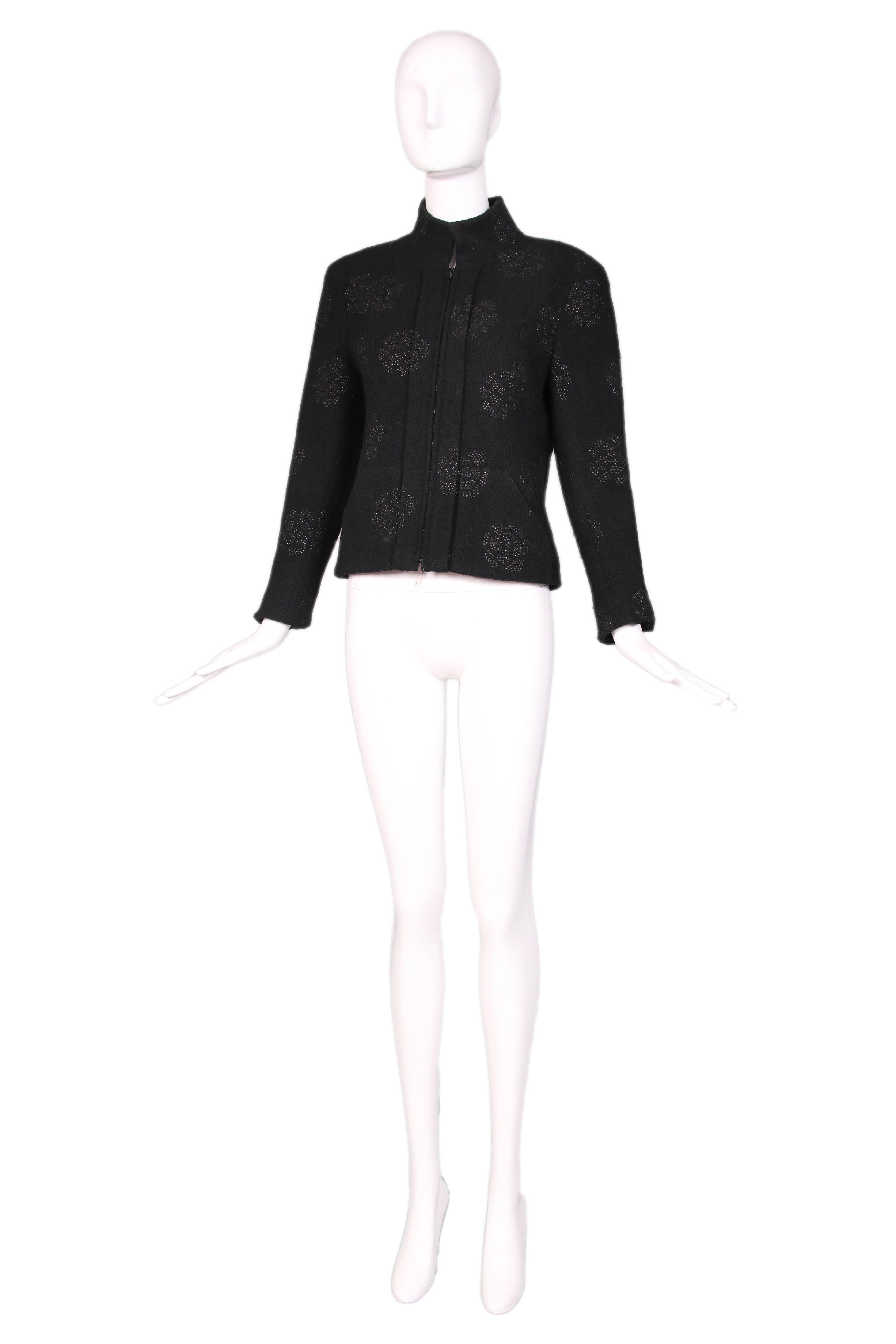 Chanel black wool boucle zipper front jacket with stand collar and sparkly camellia flower print most likely made out of raffia. Lined entirely in camellia print silk. In excellent condition. Size EU 40. 
MEASUREMENTS:
Bust - 38"
Waist -