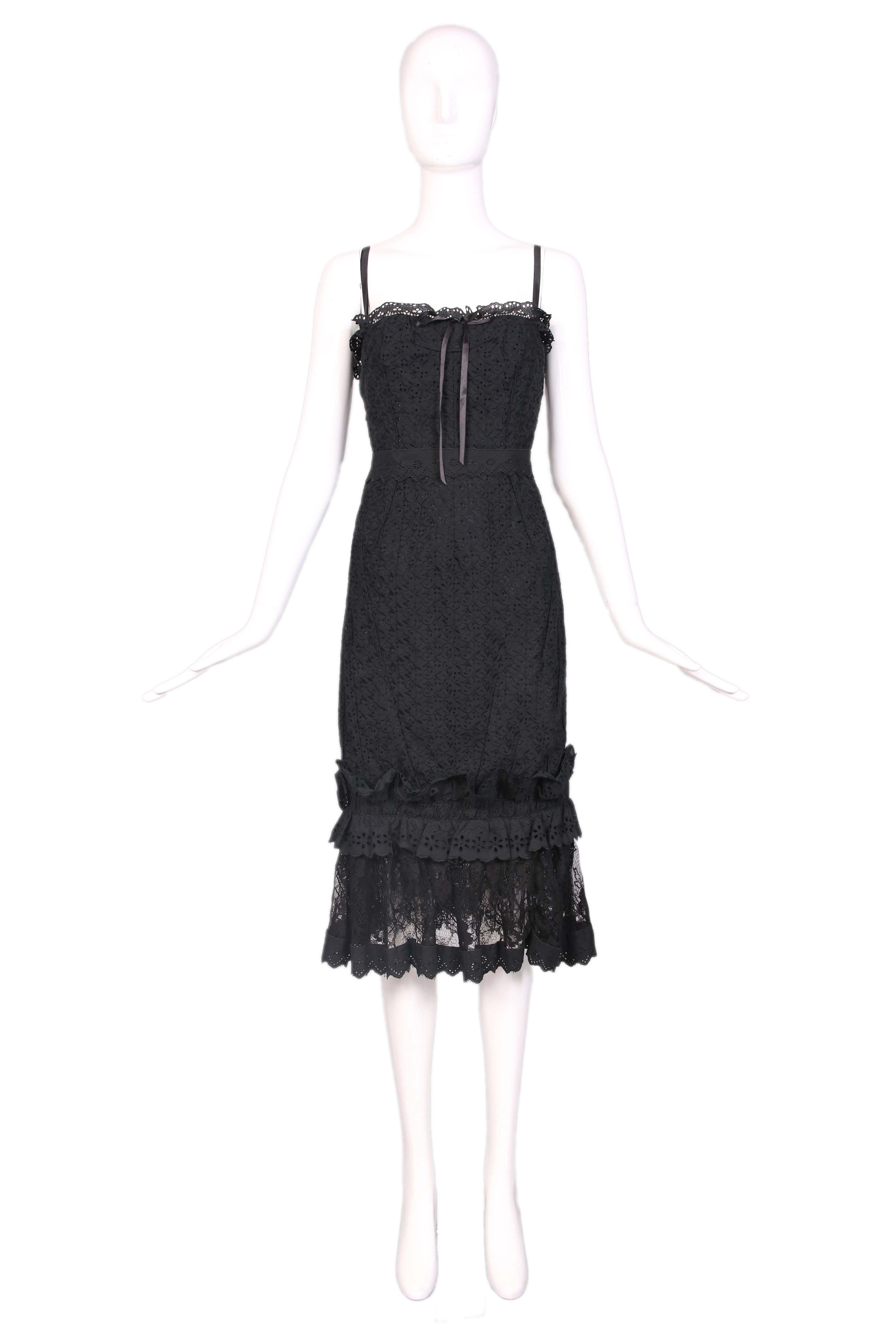 Dolce & Gabbana black eyelet lace underwire bustier dress with adjustable straps and clasp in the back. Satin ribbon bow at top and lace & eyelet hem. In excellent condition. Size EU 42. 
MEASUREMENTS:
Bust - 30"
Waist -