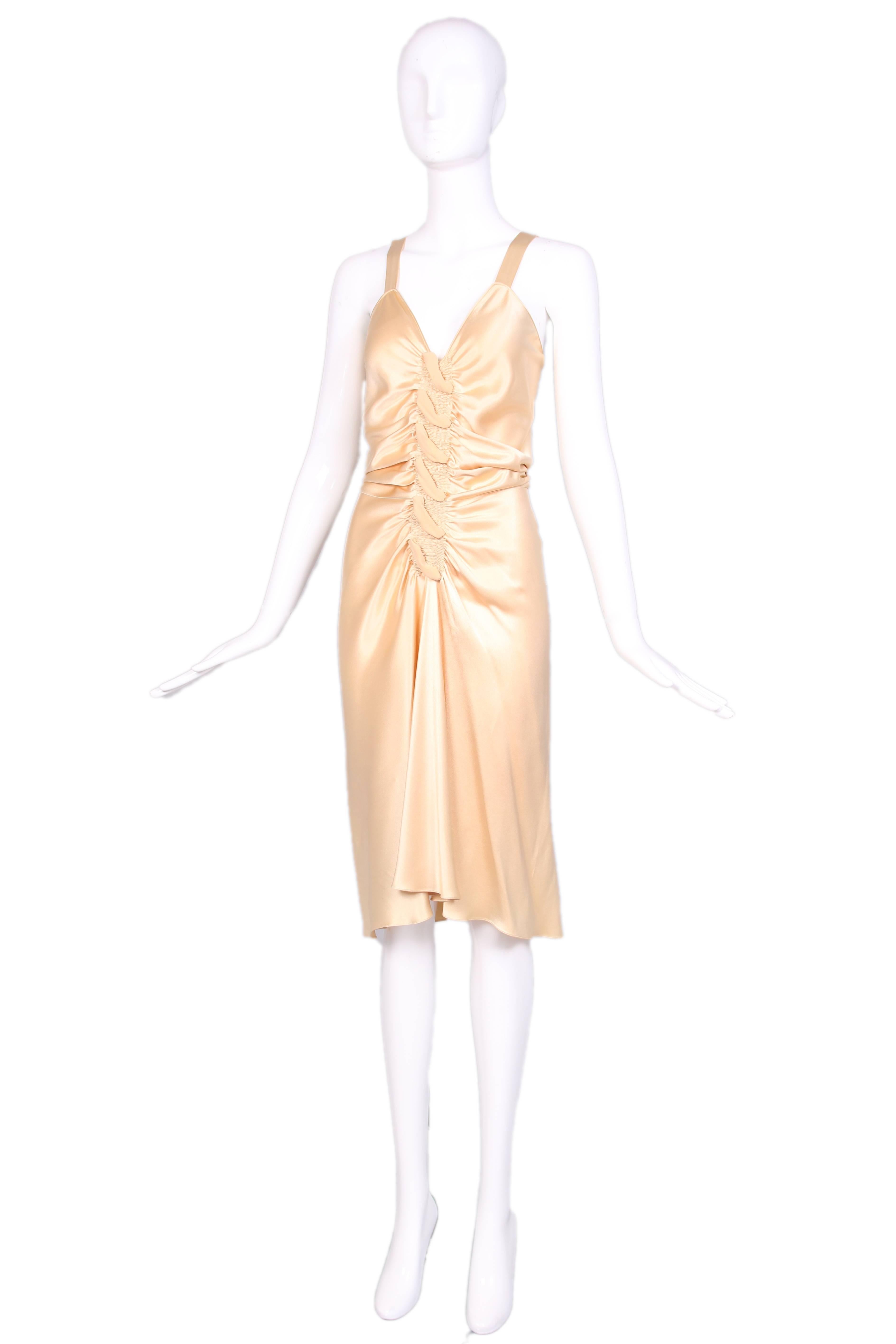John Galliano Hollywood glamorous cream bias cut evening dress with button up back and ruched detailing at front. In excellent condition with some minor abrasions hidden in folds at the back. Size US 4.
MEASUREMENTS: 
Bust - 32