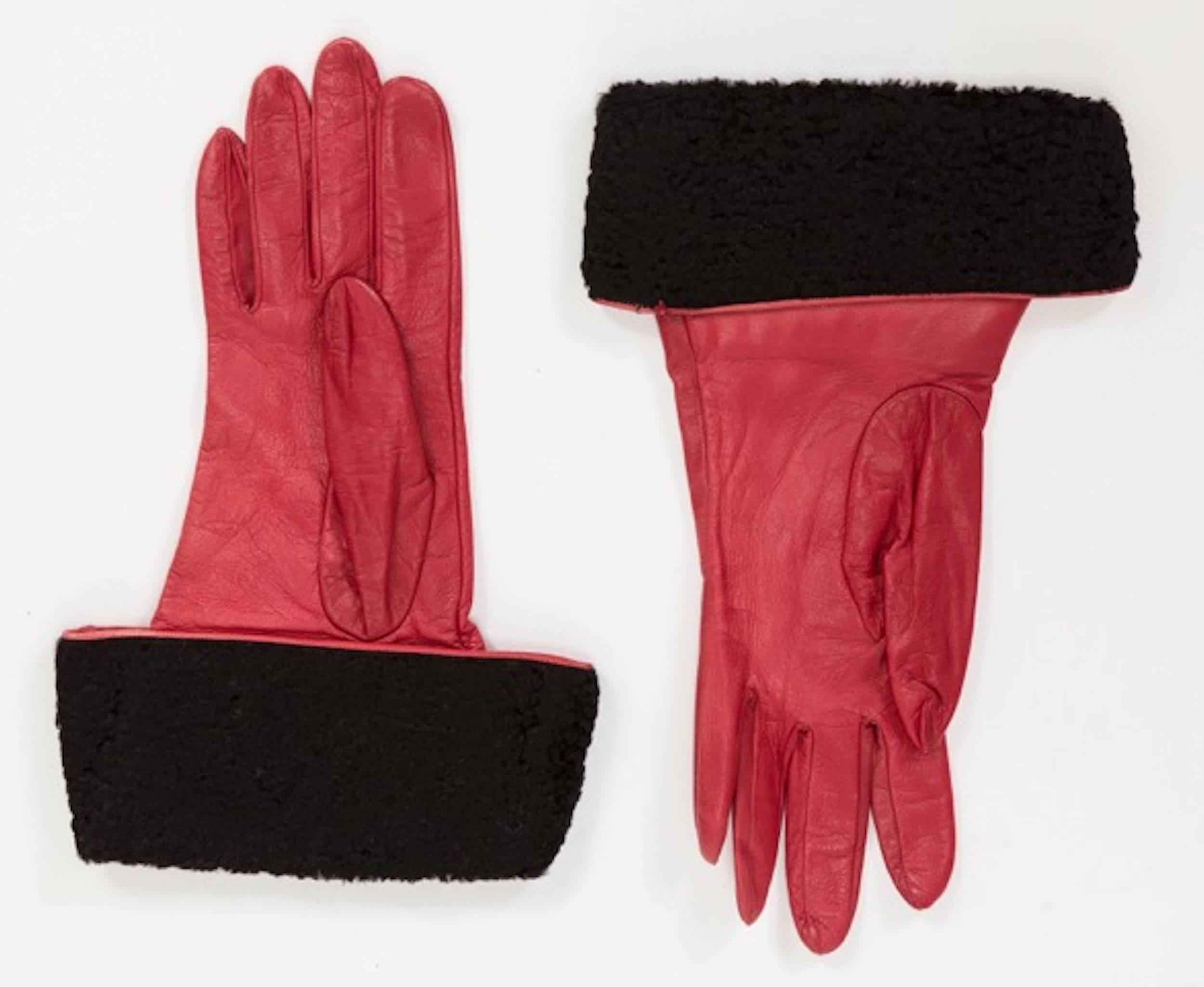 Yves Saint Laurent red leather gloves w/black sheared Mongolian fur trim at cuffs. In excellent condition. Size 7.5. 
