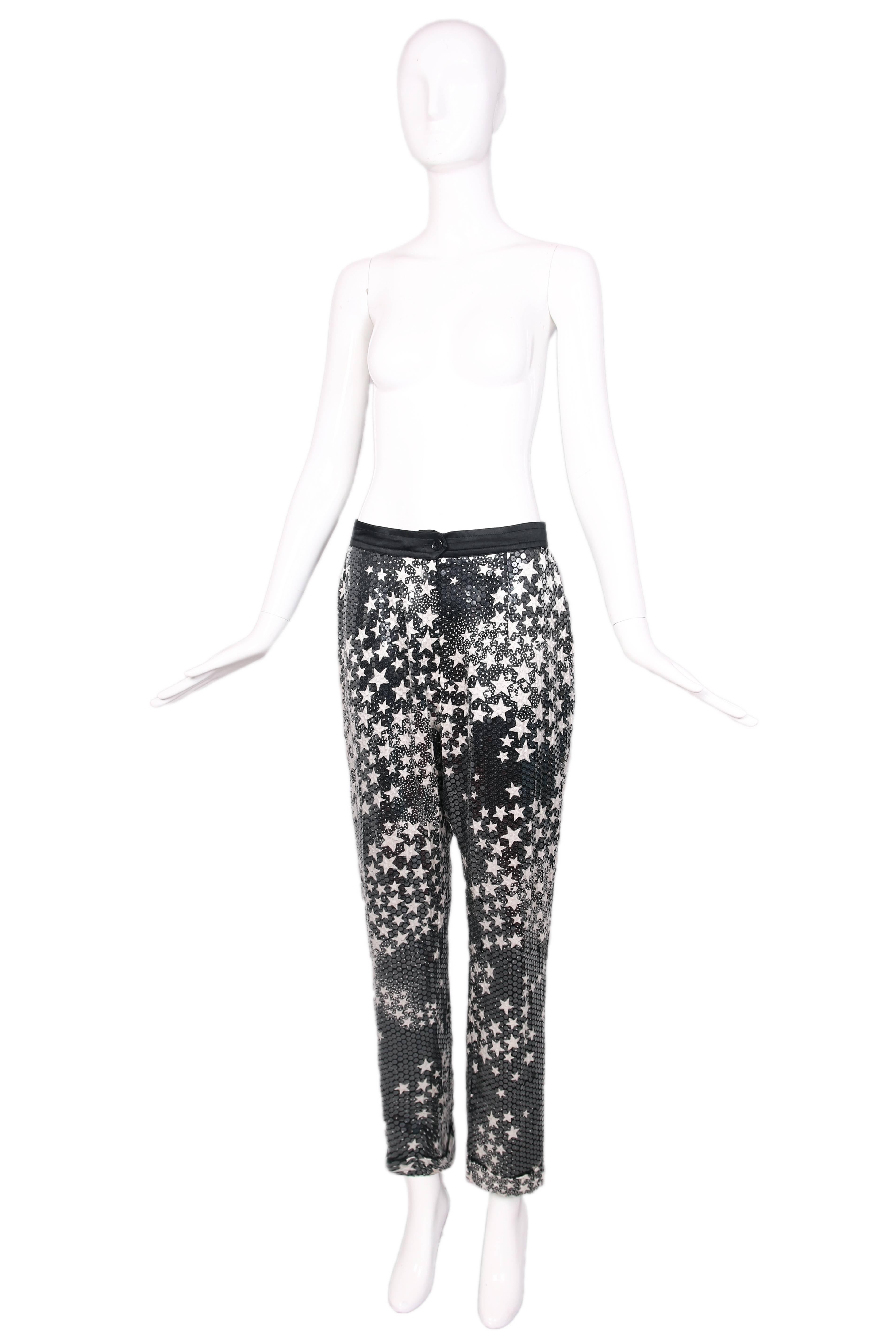 Black silk pants w/ clear sequin all over and white star print. Black waist band with button and zipper closure. In excellent condition. No tag, please consult measurements. 
MEASUREMENTS:
Waist - 28