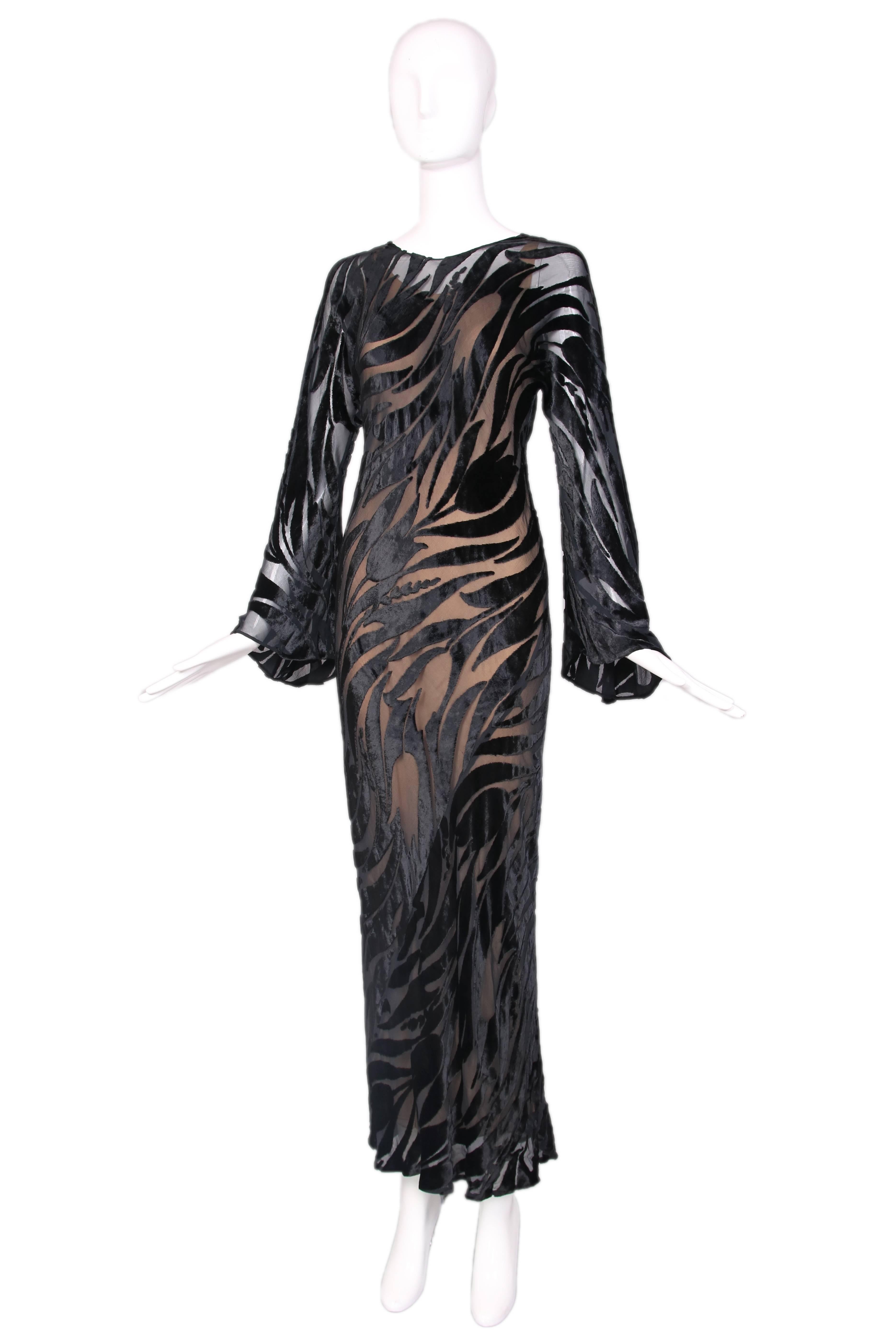 1974 Halston black silk velvet burnout evening gown w/ bell sleeves. Velvet tulip pattern all over and nude colored slip dress underneath - both slip and gown are cut on the bias. In excellent condition. No size tag, please consult measurements.
