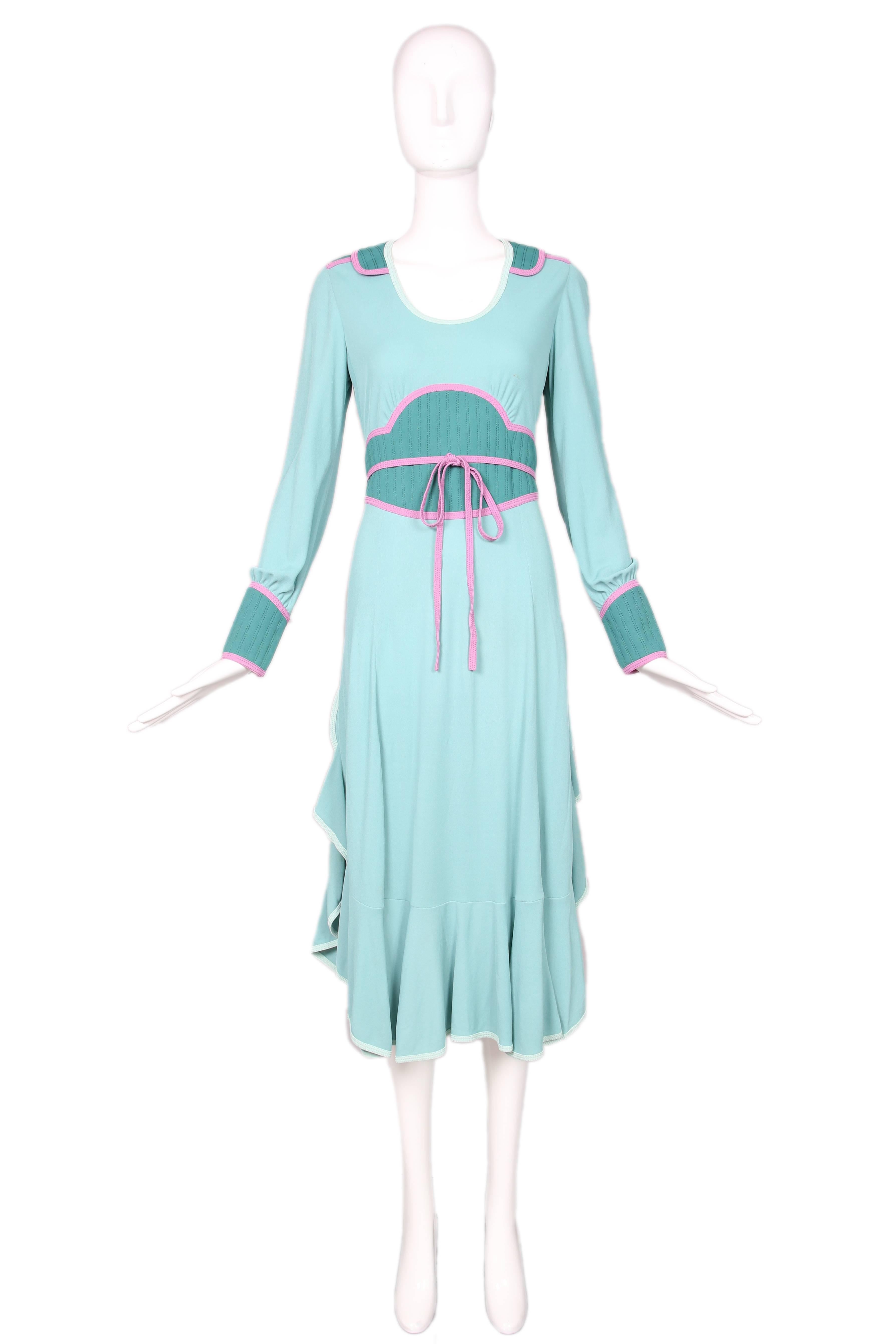 From the iconic 2002 collection is this Marc Jacobs green & pink long sleeved color blocked maxi dress w/quilted colorblock detailing at cuffs, bodice, and shoulder. Features a pink tie at waist and ruffling at skirt sides & hem. In