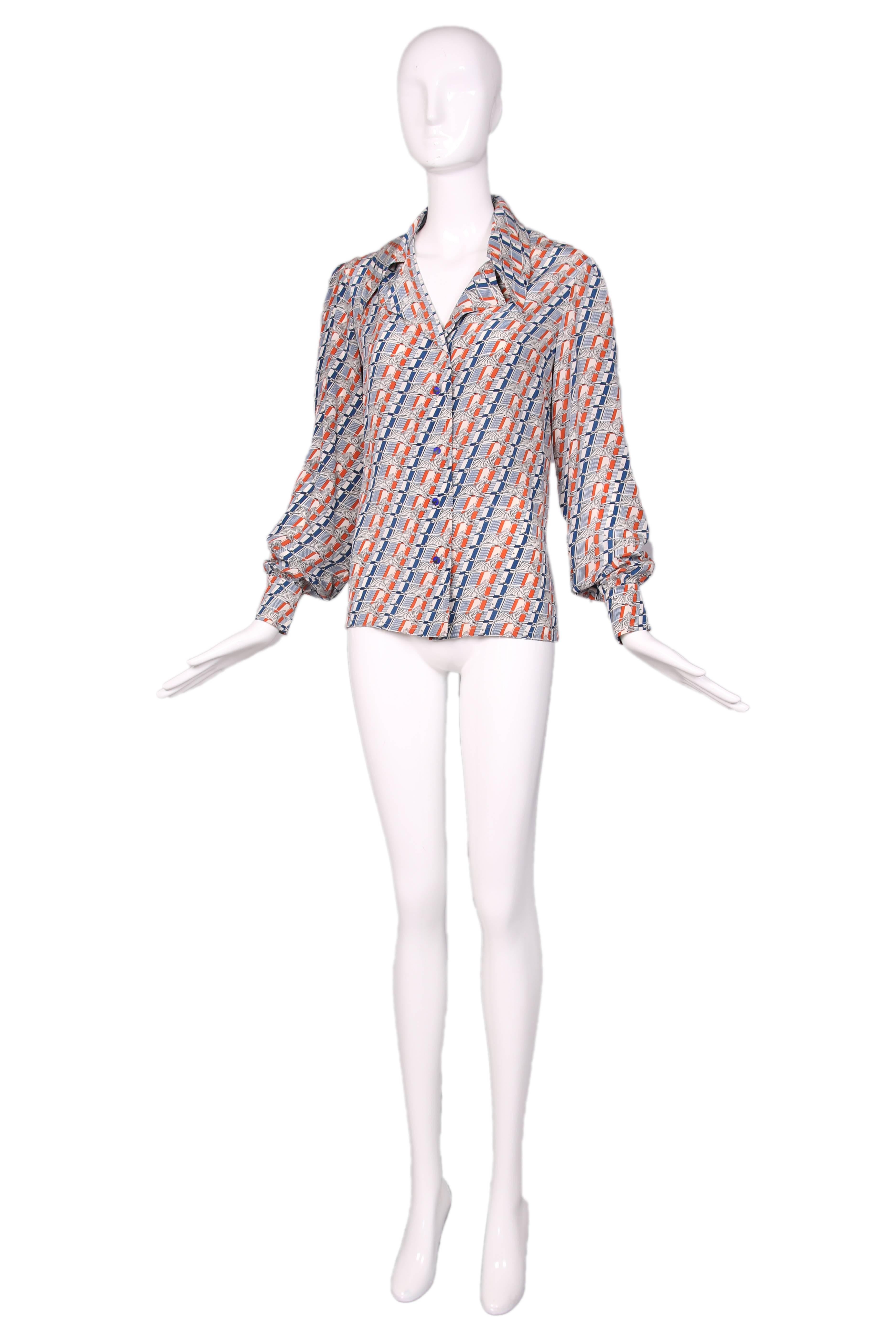 1970's Gucci blue & orange striped long sleeved silk blouse with a zebra print & matching zebra enamel buttons down the front. In excellent condition. 
MEASUREMENTS: 
Bust - 42