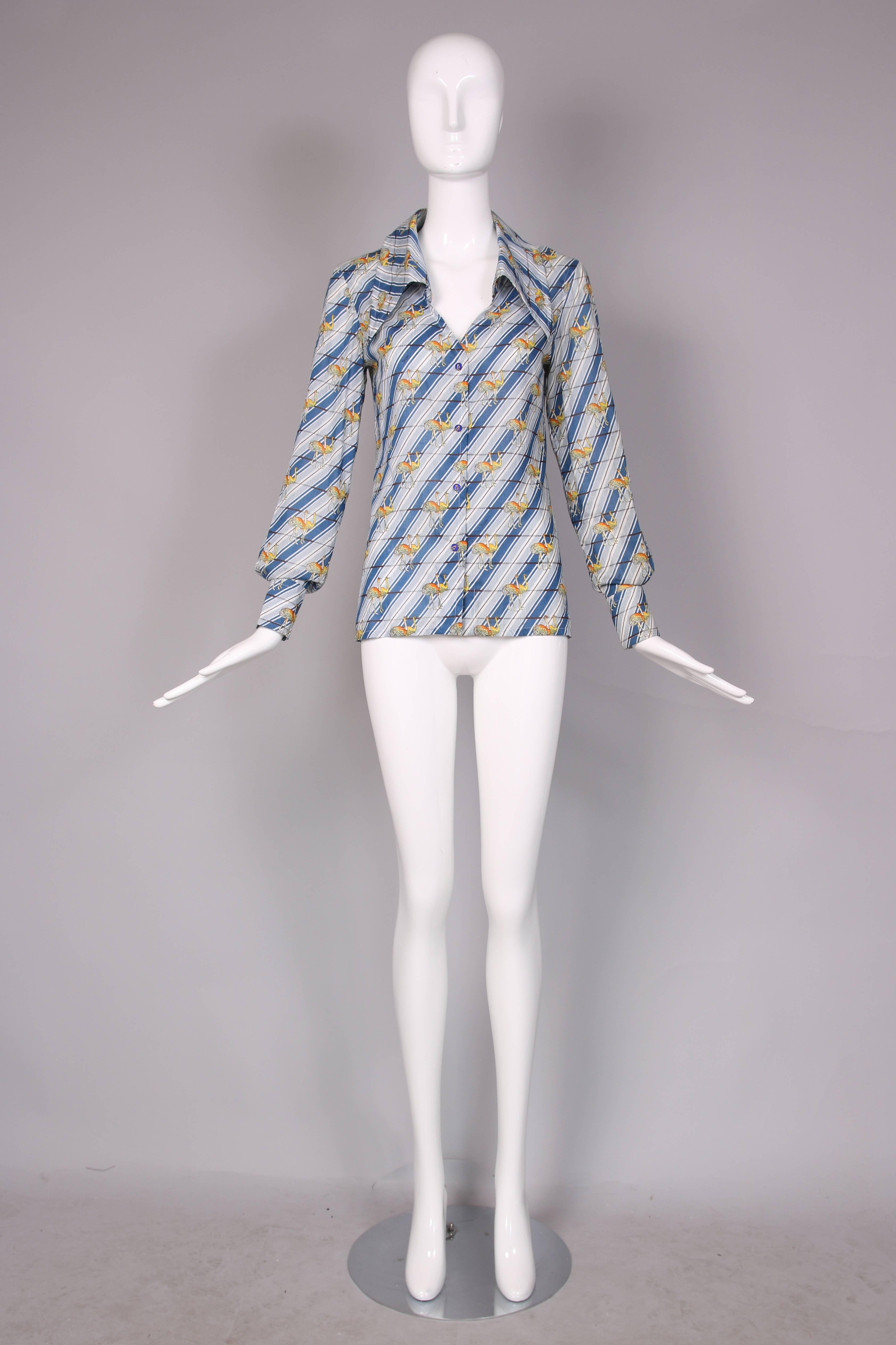 1970's Gucci blue & white striped cotton long sleeved ostrich print blouse with oversized collar and matching ostrich-themed enamel buttons down the front. In excellent condition. .
MEASUREMENTS:
Bust - 34