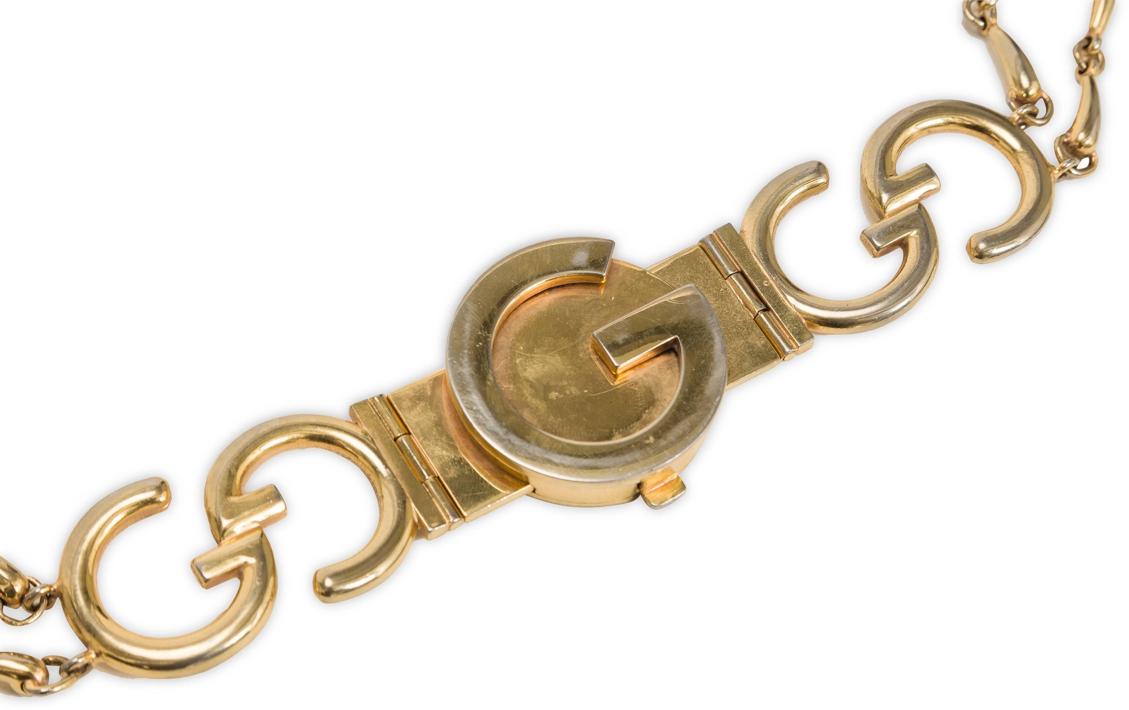 1970's Gucci gold tone belt featuring interlocking golden metal Gucci GG logo and horsebit-inspired links. To fasten, the 