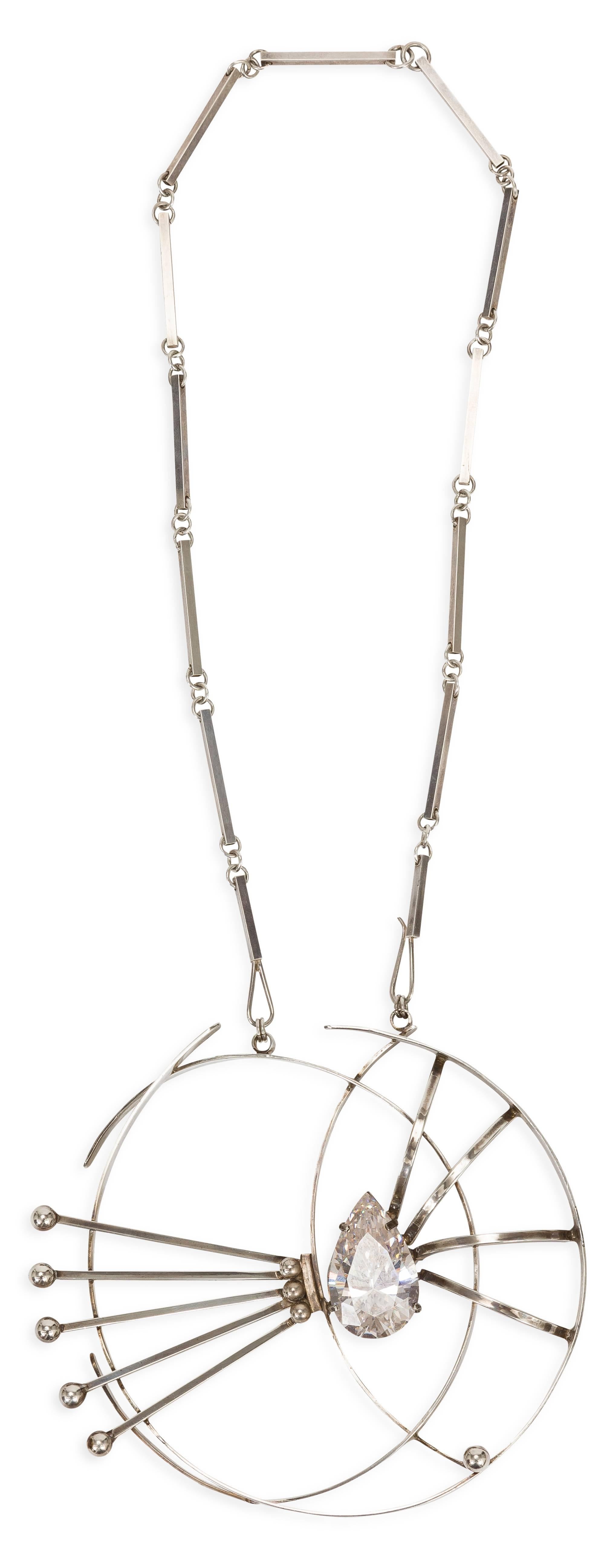 Aaron Rubenstein mid-century custom necklace with flat bar link chain and large  pendant with center abstract design and center tear drop crystal. Signed Aaron Rubenstein / Sterling.
MEASUREMENTS:
Chain drop -  14