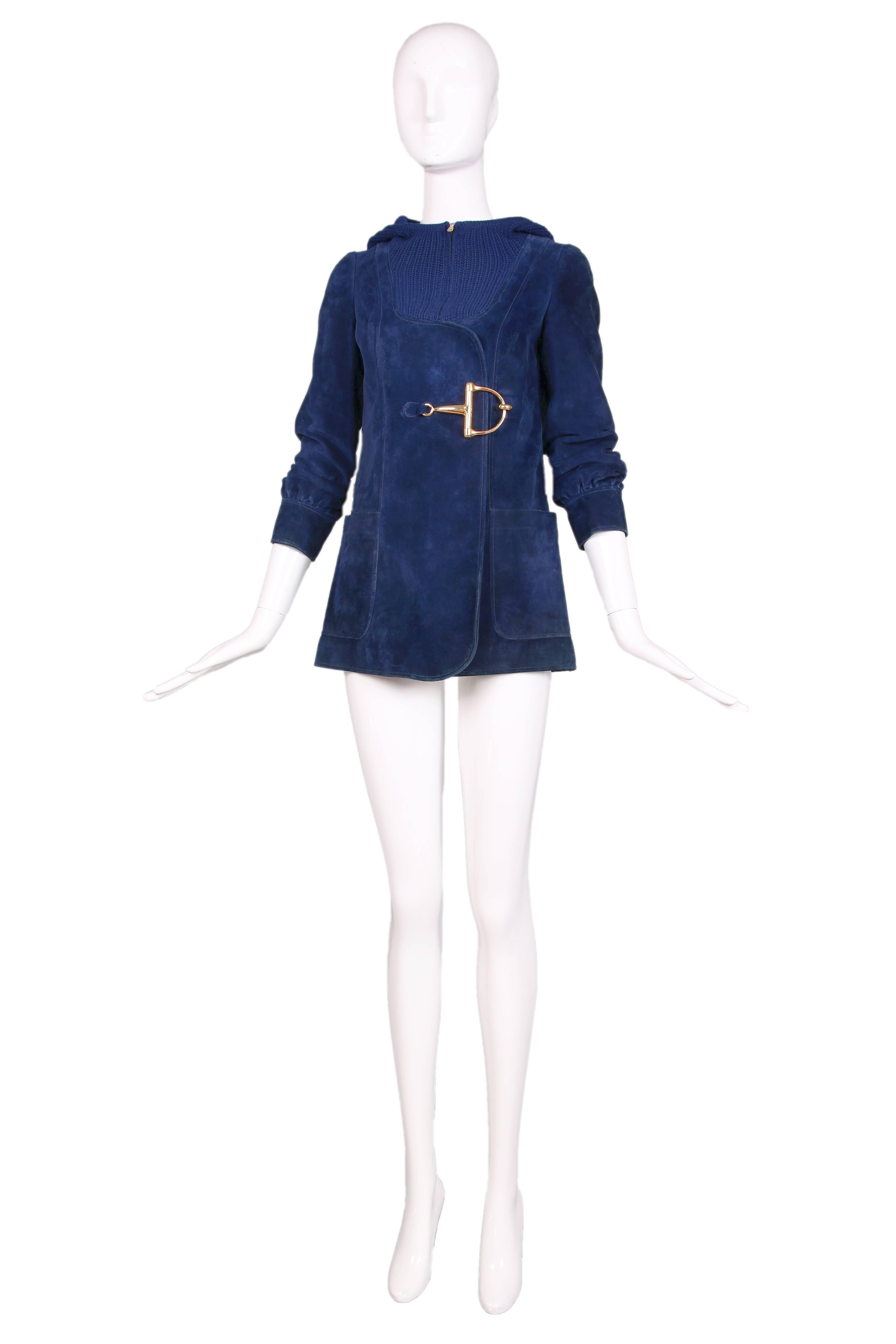 Vintage Gucci blue suede jacket with a chunky knit wool hood that dips into the bodice front. Features an over-sized gold-toned classic Gucci horsebit clasp closure at the front and two frontal pockets. Fully lined in white silk fabric with