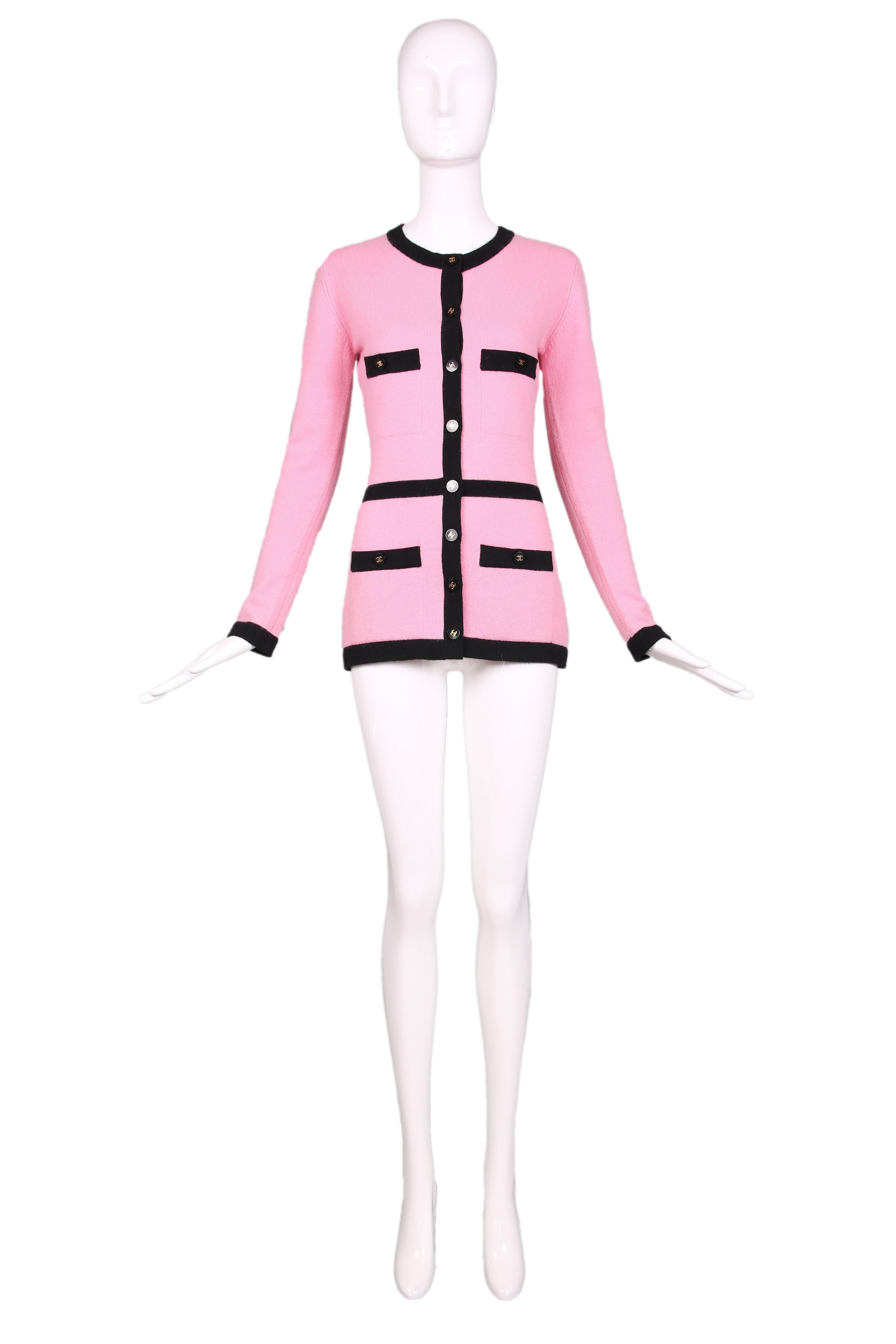 1995 Autumn Chanel pink cashmere cardigan with black trim and Chanel CC logo buttons down the front, at the sleeves, and at four front pockets. In excellent condition. Size EU 38.
MEASUREMENTS:
Bust - 34"
Waist - 28"
Hip -