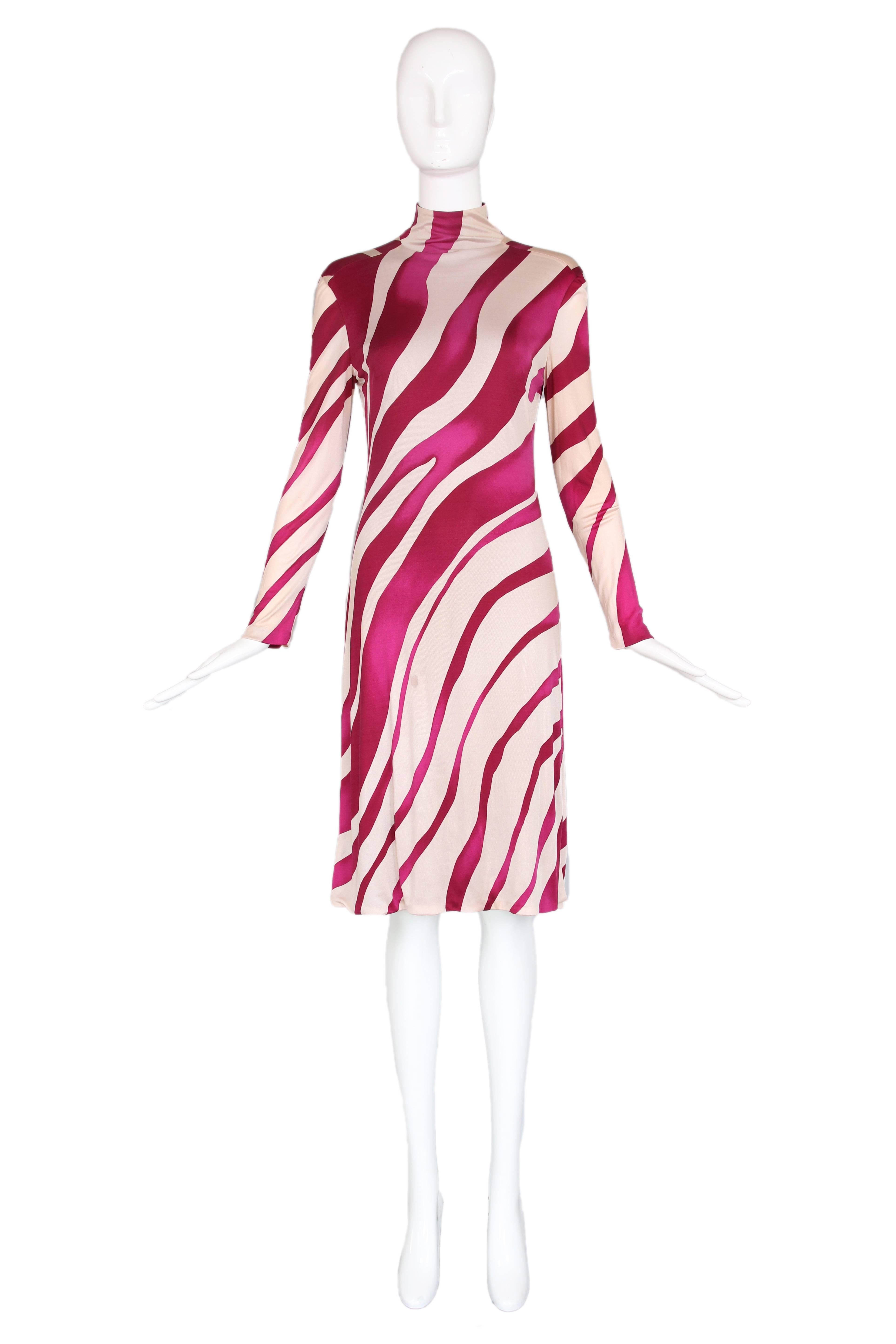 Versace Couture silk blend magenta tiger stripe print long sleeved mock turtle neck Medusa dress. Zip up back with medusa buttons at back neck. In excellent condition with a few tiny abrasions to  the fabric. Size IT 40, US 6. 
MEASUREMENTS:
Bust