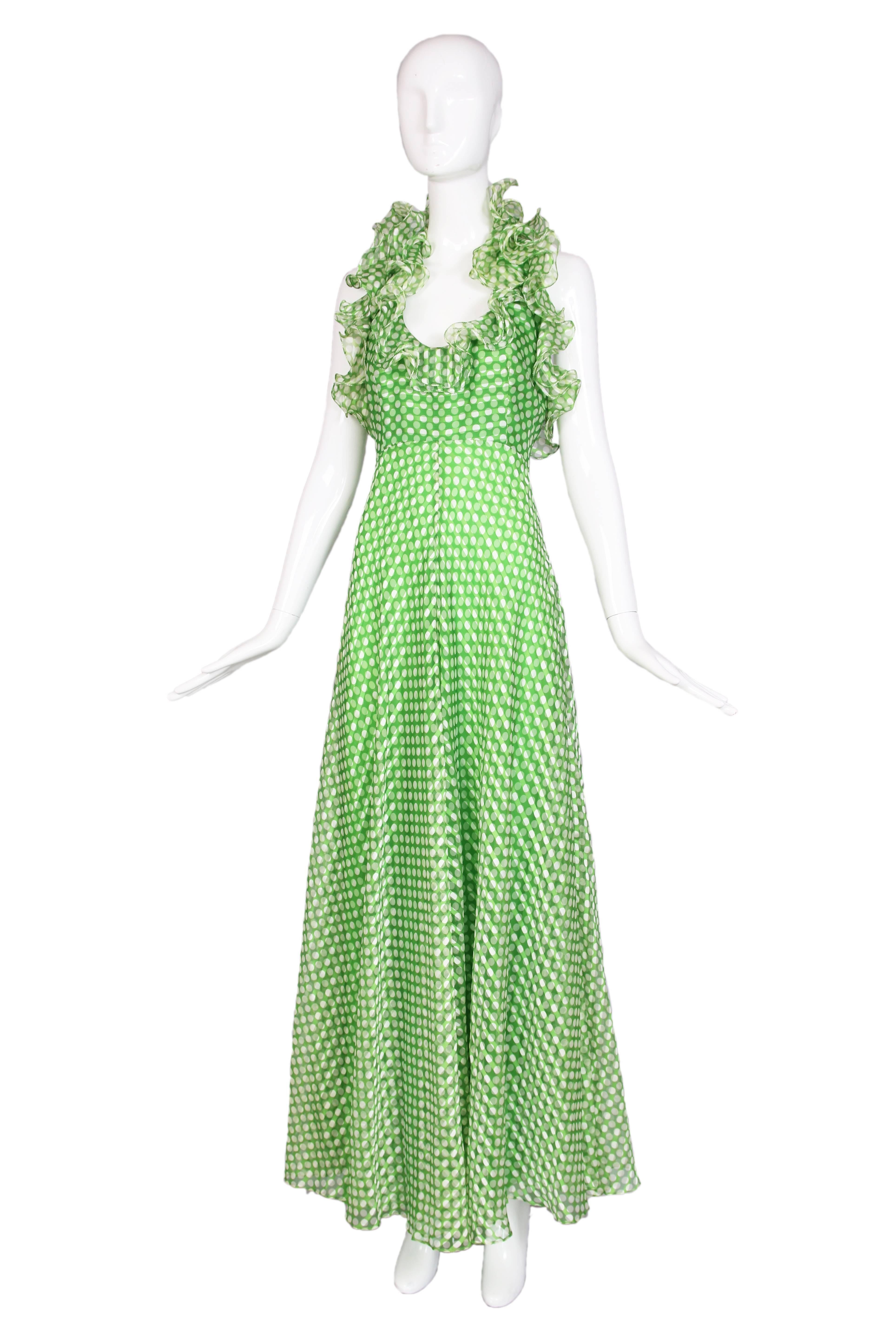 1970's Geoffrey Beene green & white polka dot halter dress featuring ruffled trim. Fully lined. In excellent condition. No size tag, please consult measurements.
MEASUREMENTS:
Bust - 33