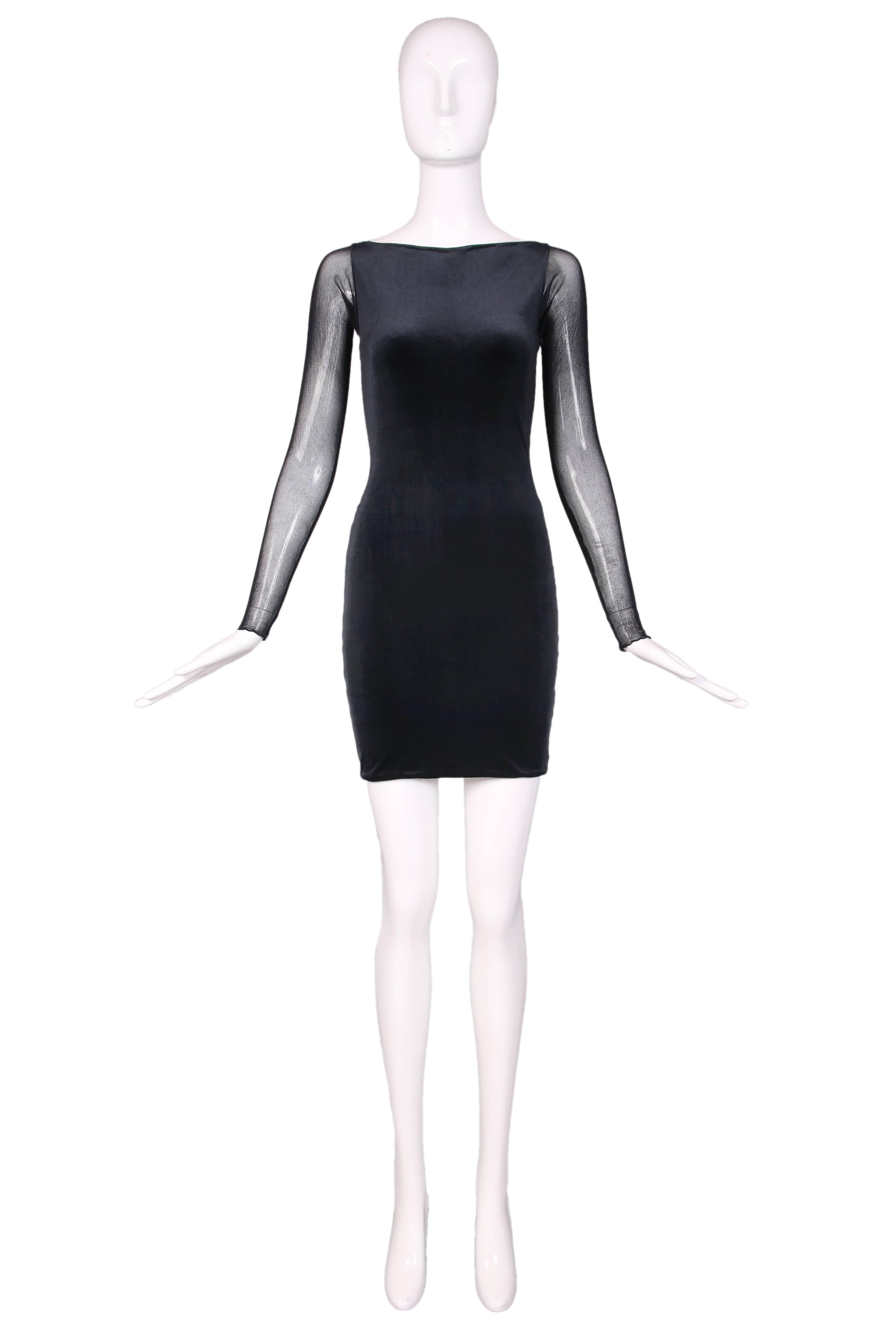 Vintage Giorgio Di Sant Angelo black bodycon dress W/stretch velvet front, illusion sleeves and back. In excellent condition. No size tag, please consult measurements.
MEASUREMENTS:
Bust - 30