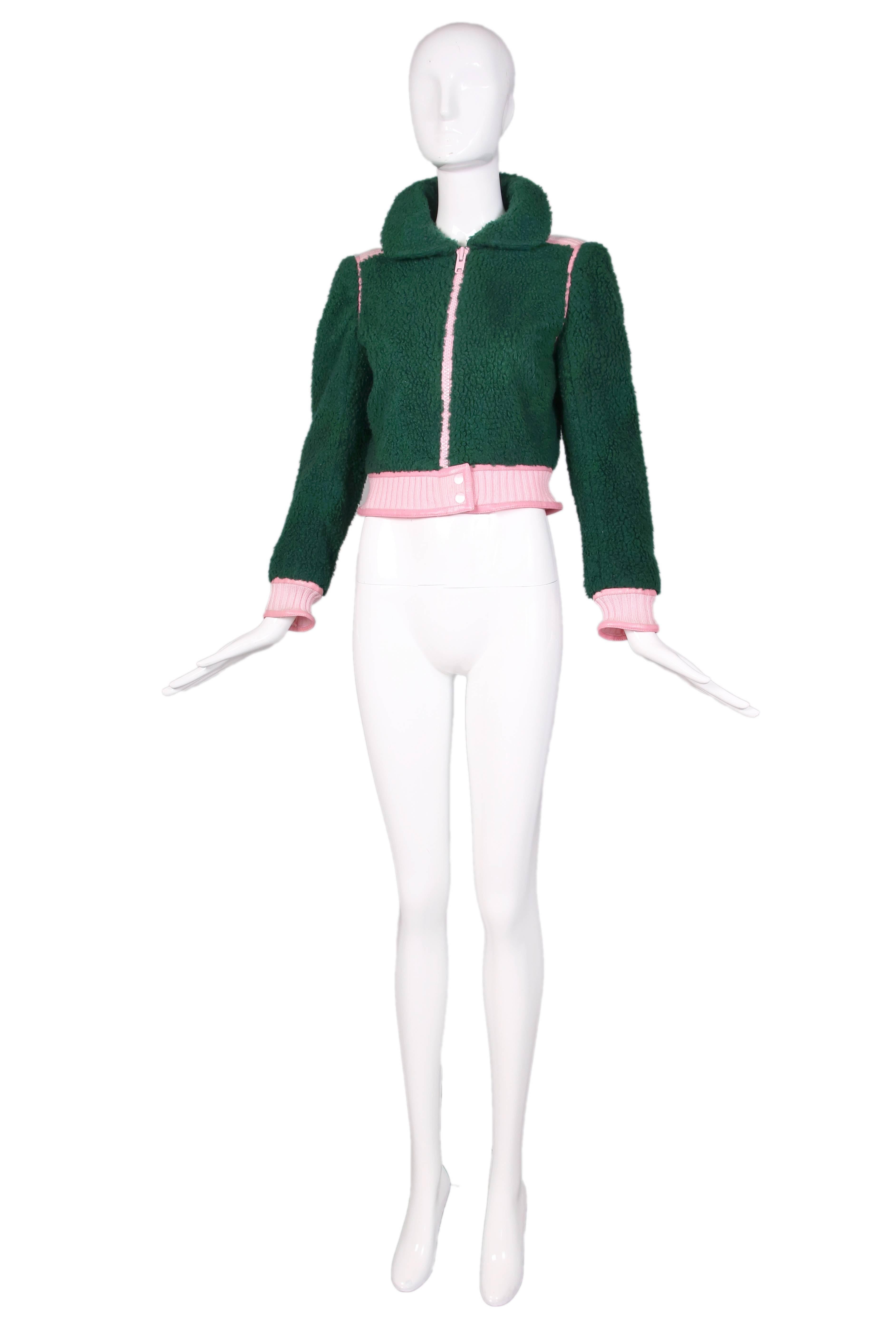 1970's Courreges green shearling jacket w/pink leather and knit trim which fastens up center front with an oversized pink front zipper. In excellent condition. No size tag, please consult measurements.
MEASUREMENTS:
Bust - 36