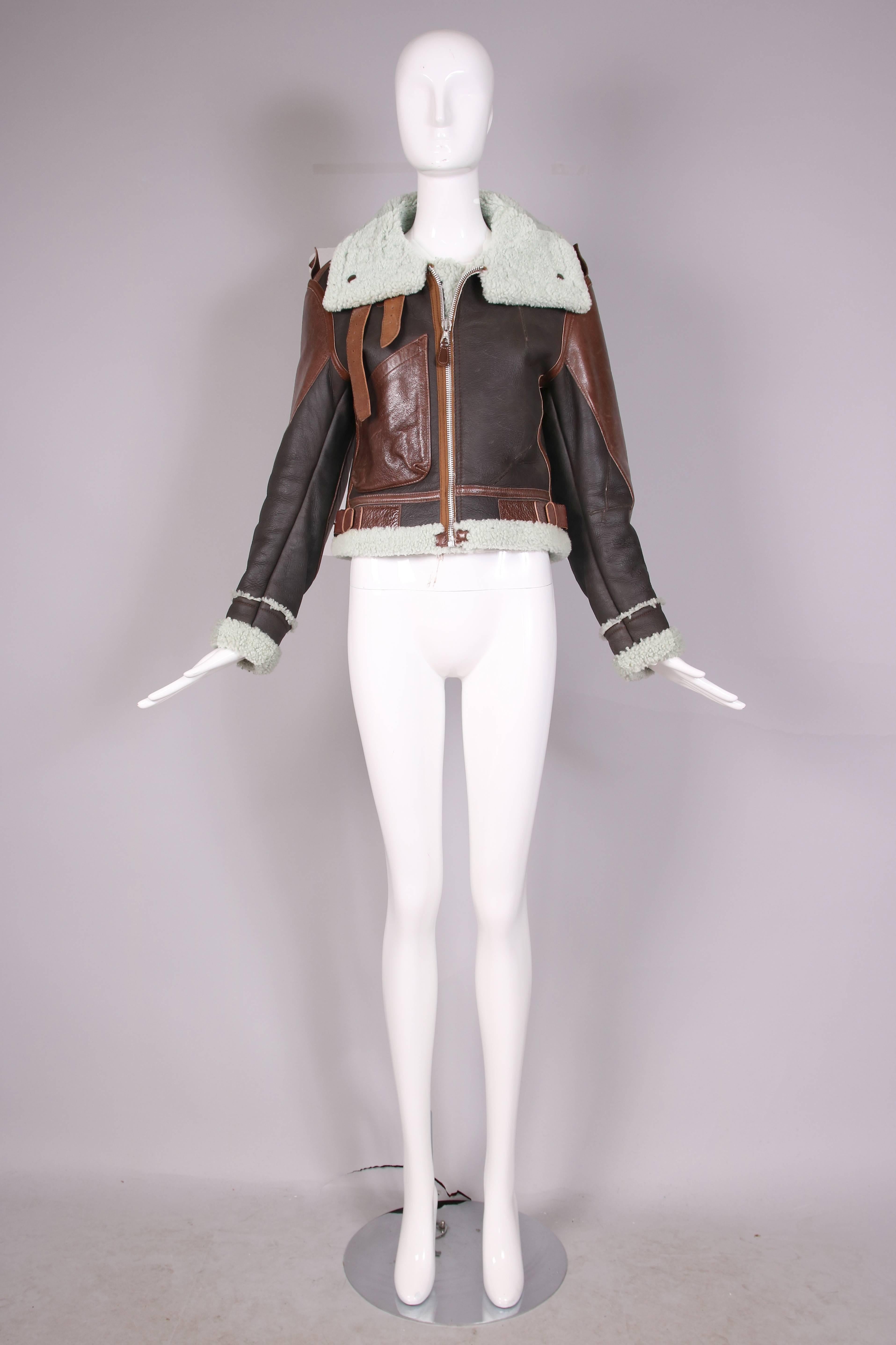 Balenciaga by Ghesquire cropped leather "Palma Aviator Jacket." This jacket is completely lined and trimmed in pale green shearling. In excellent condition. Size EU 40.
MEASUREMENTS:
Bust - 36"
Waist - 34"
Shoulder -