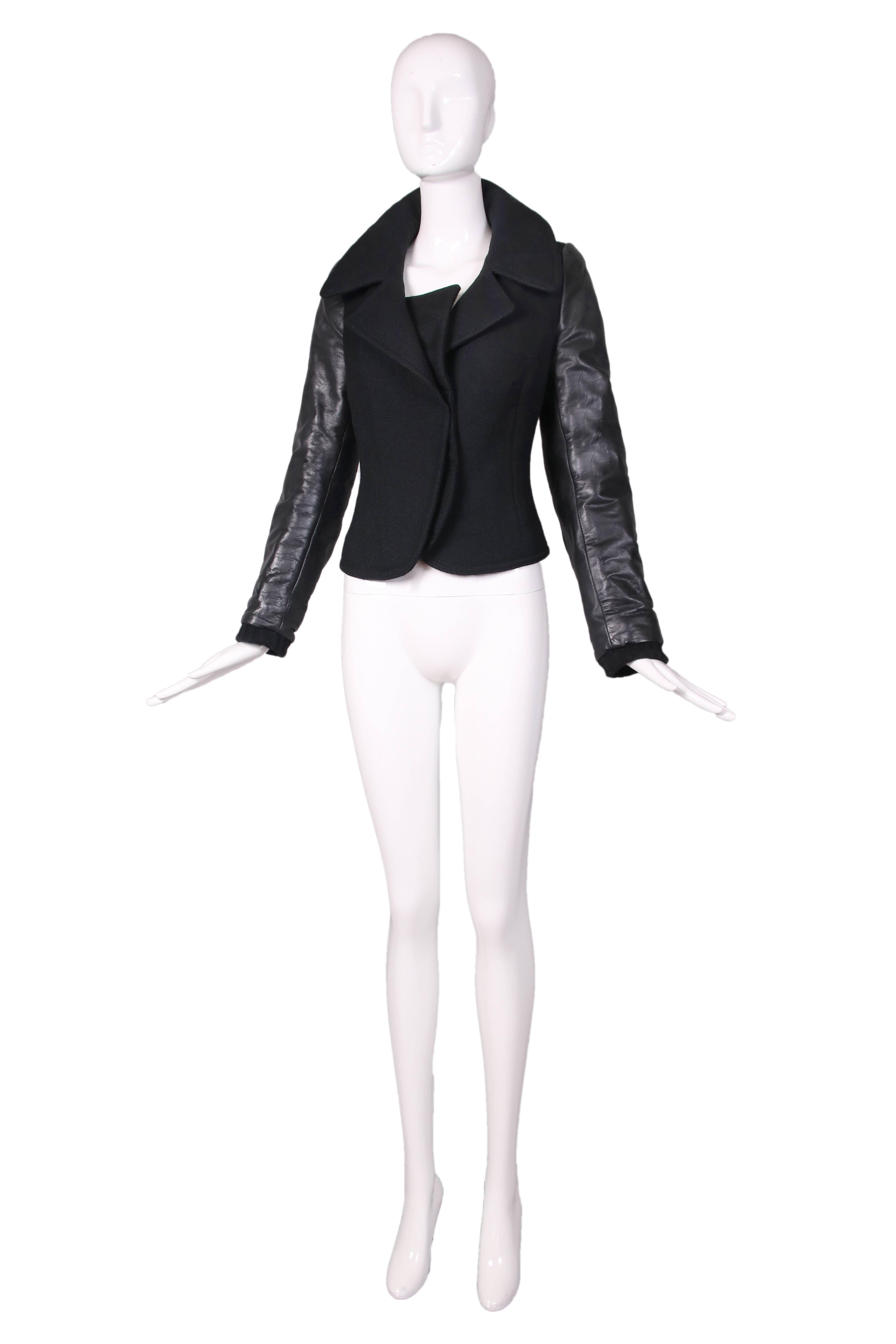 Balenciaga by Ghesquiere black biker or flight style jacket w/leather sleeves and wool blend bodice and cuffs. In excellent condition. Size EU 38.
MEASUREMENTS:
Bust - 36