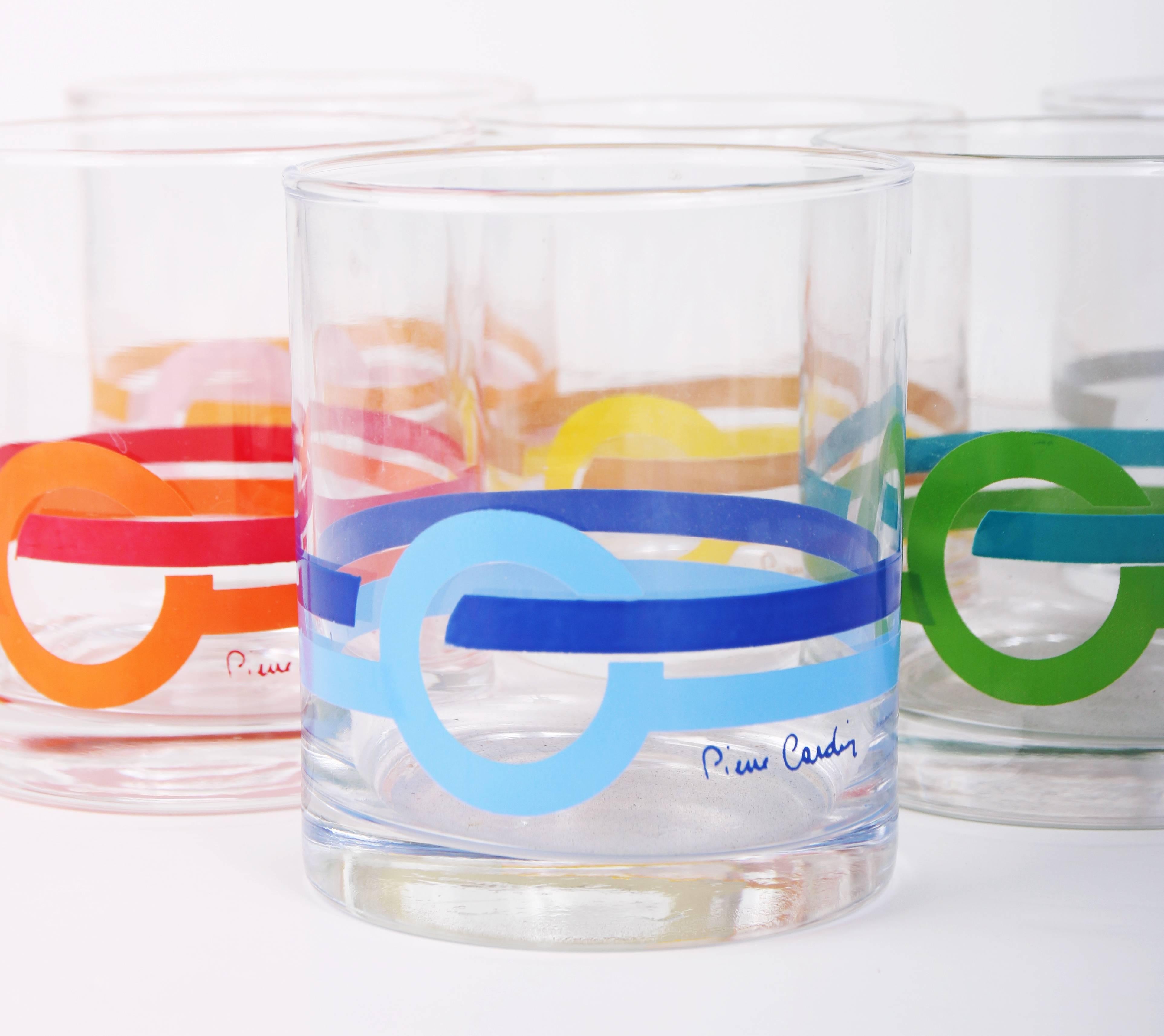 A set of 6 1970's signed Pierre Cardin multi-colored lowball drinking glasses with classic Cardin logo graphic at the bottom third. Holds roughly 10 ounces.
MEASUREMENTS:
Height - (approx.) 3 3/4