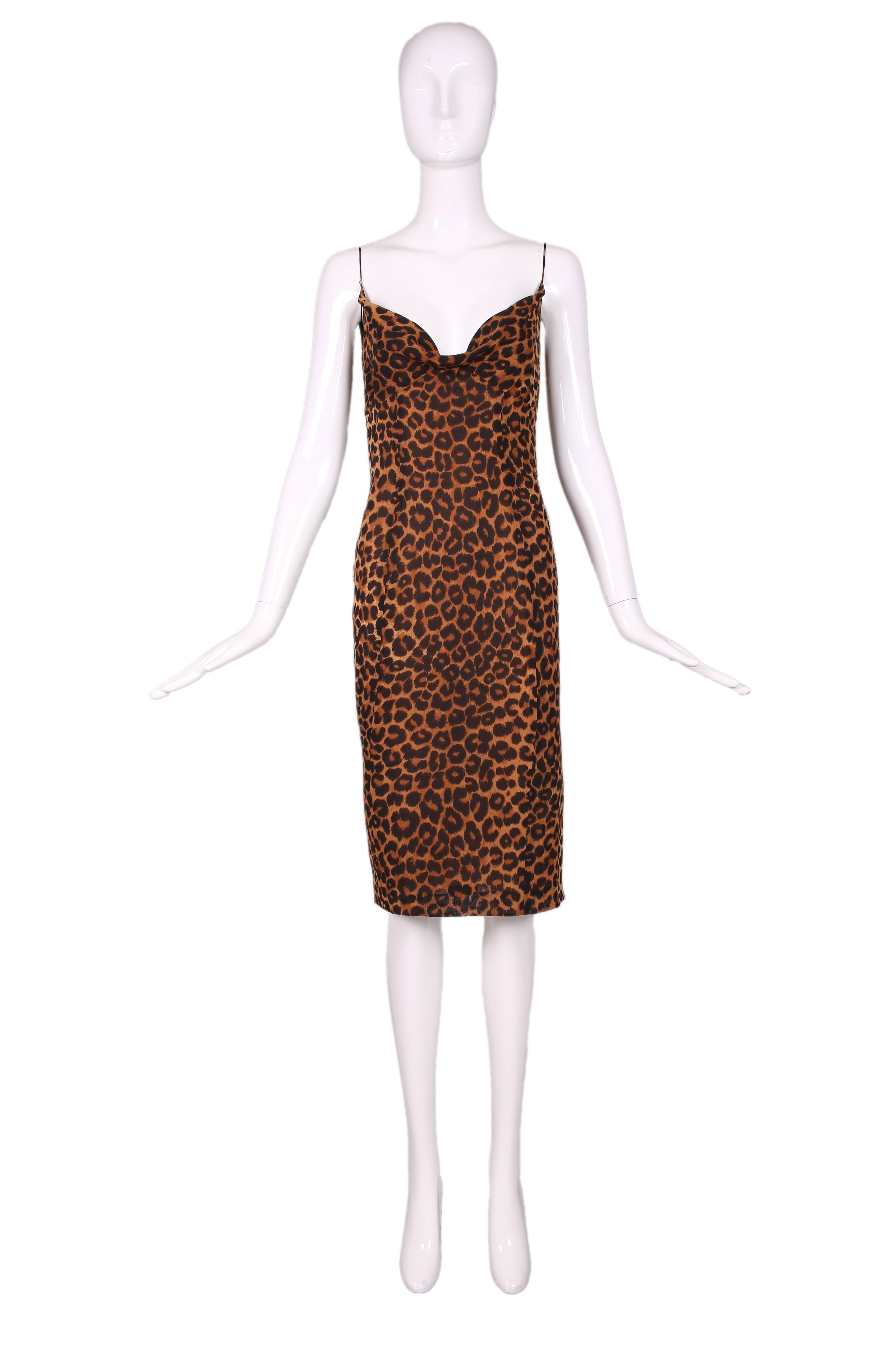 1990's John Galliano silk leopard print slip dress w/slight cowl neck, spaghetti straps and side slit. Zipper closure at side and lined in silk.In excellent condition. Size US 4.
MEASUREMENTS:
Bust - 34