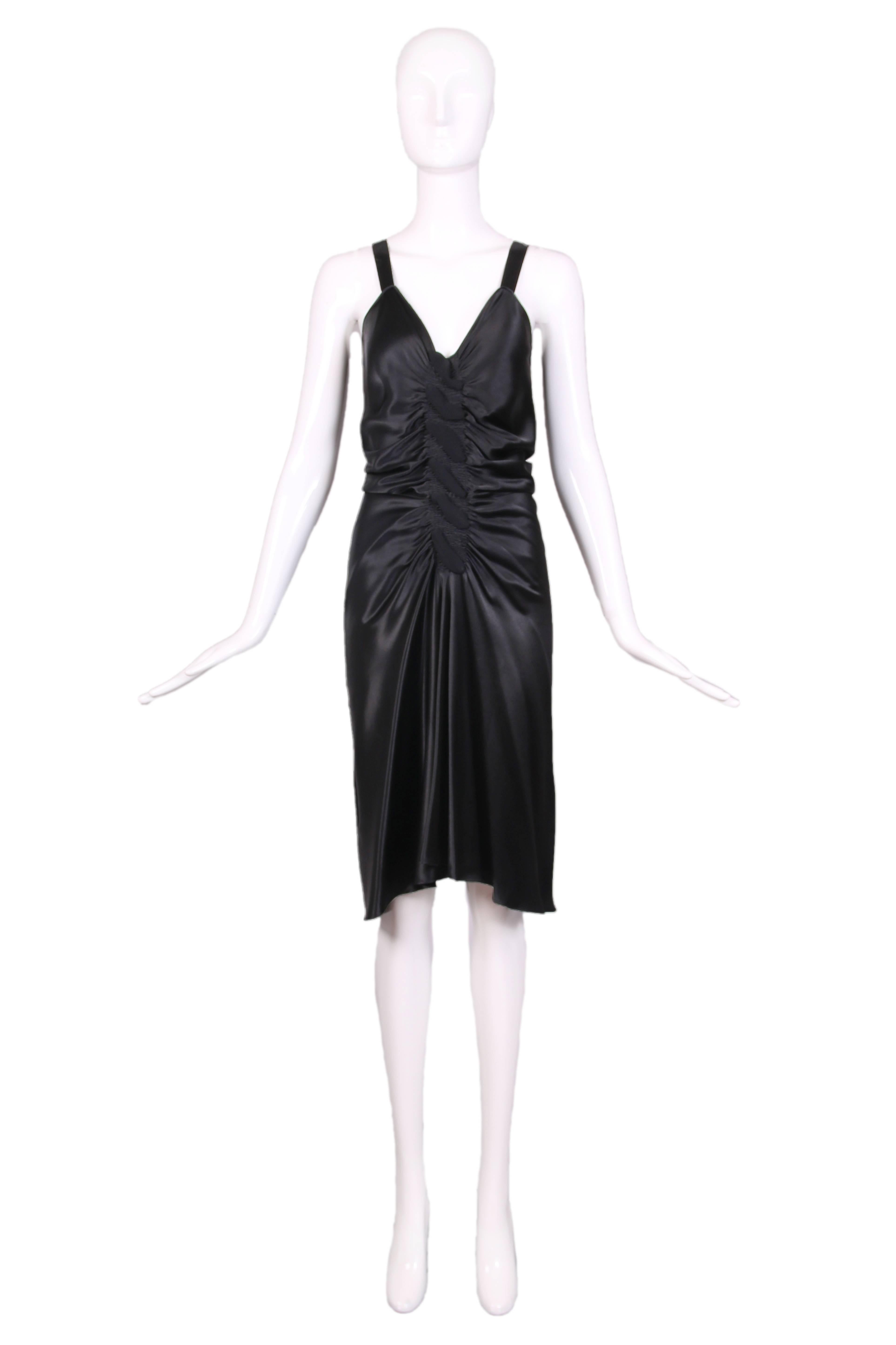 Vintage John Galliano black bias cut cocktail dress w/ frontal ruching, deep V-neckline, and shoulder straps. Fabric-covered button closure at back. In excellent condition. Size US 4.
MEASUREMENTS (in inches):
Bust - 32
Waist - 27
Hip - 40
Length -