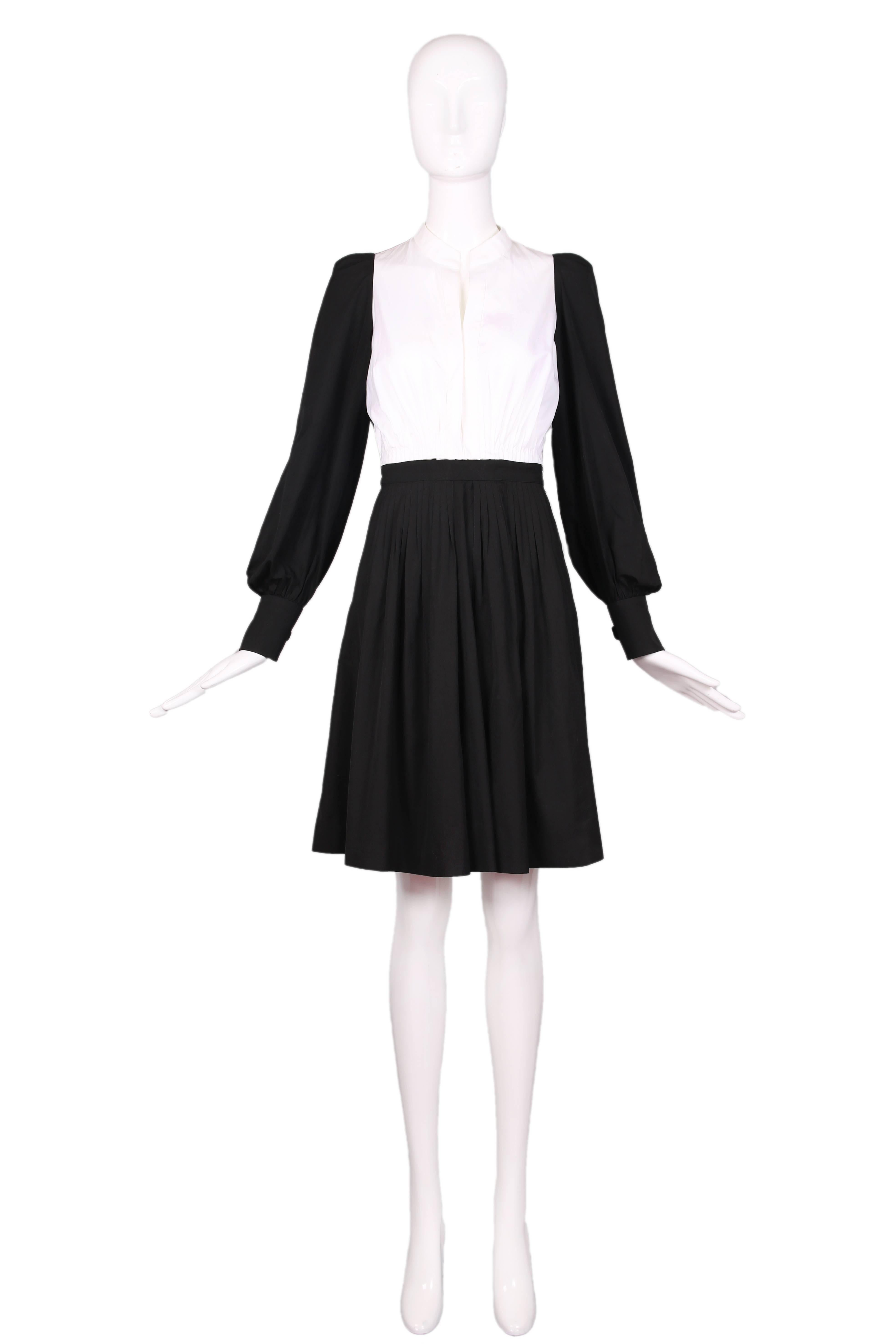 Yves Saint Laurent black and white color block cotton dress with pleating at waistline (both at skirt and blouse) and attached waist tie. In excellent condition. 
MEASUREMENTS (in inches):
Bust - 36
Waist - (approx.) 28
Hip - Free
Length - 38
