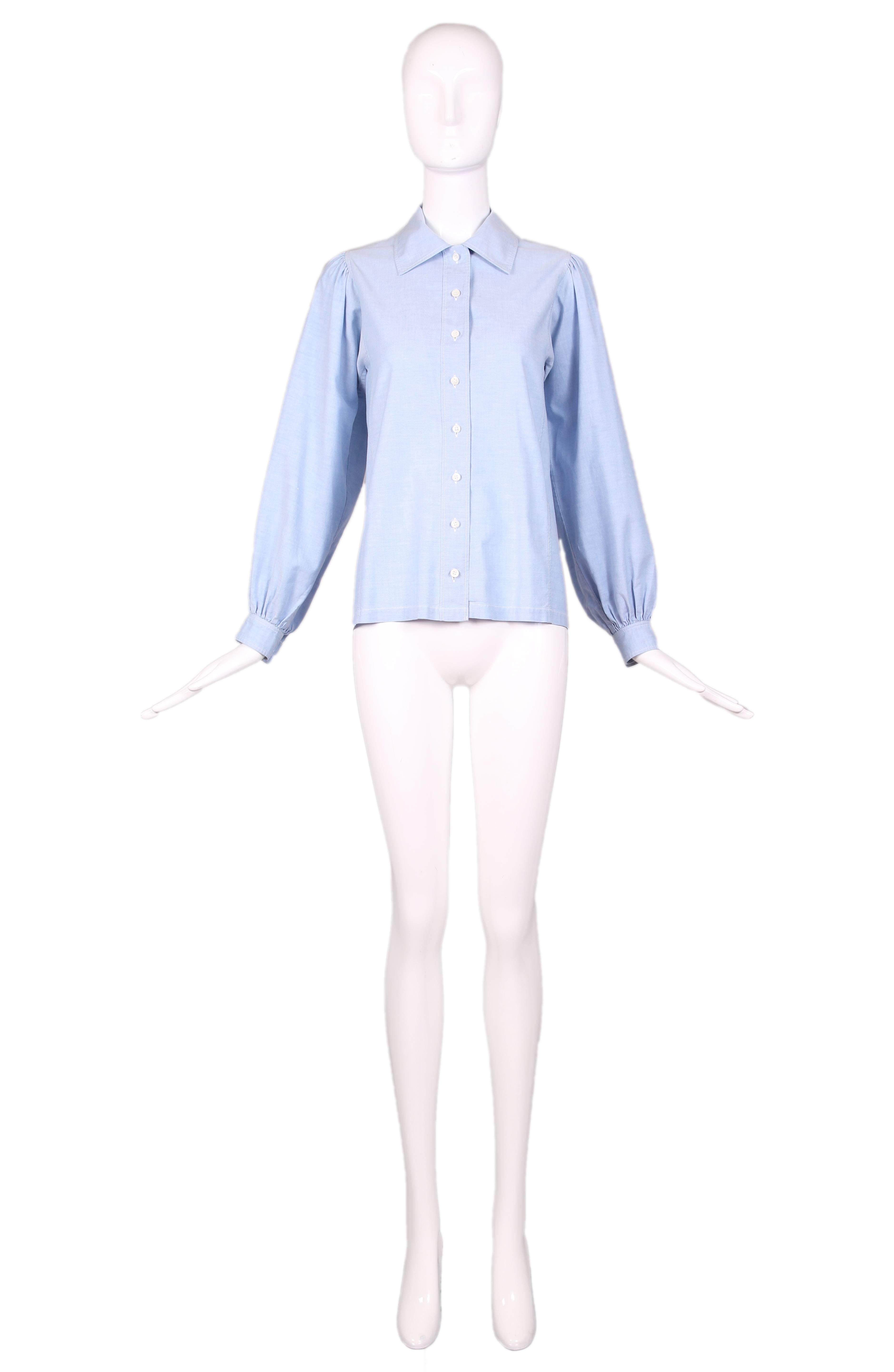 1970's Yves Saint Laurent YSL chambray button down shirt blouse. with oversize sleeves. In excellent condition. Size EU 40. 
MEASUREMENTS (in inches):
Bust - 36
Waist - 36
Length - 24
