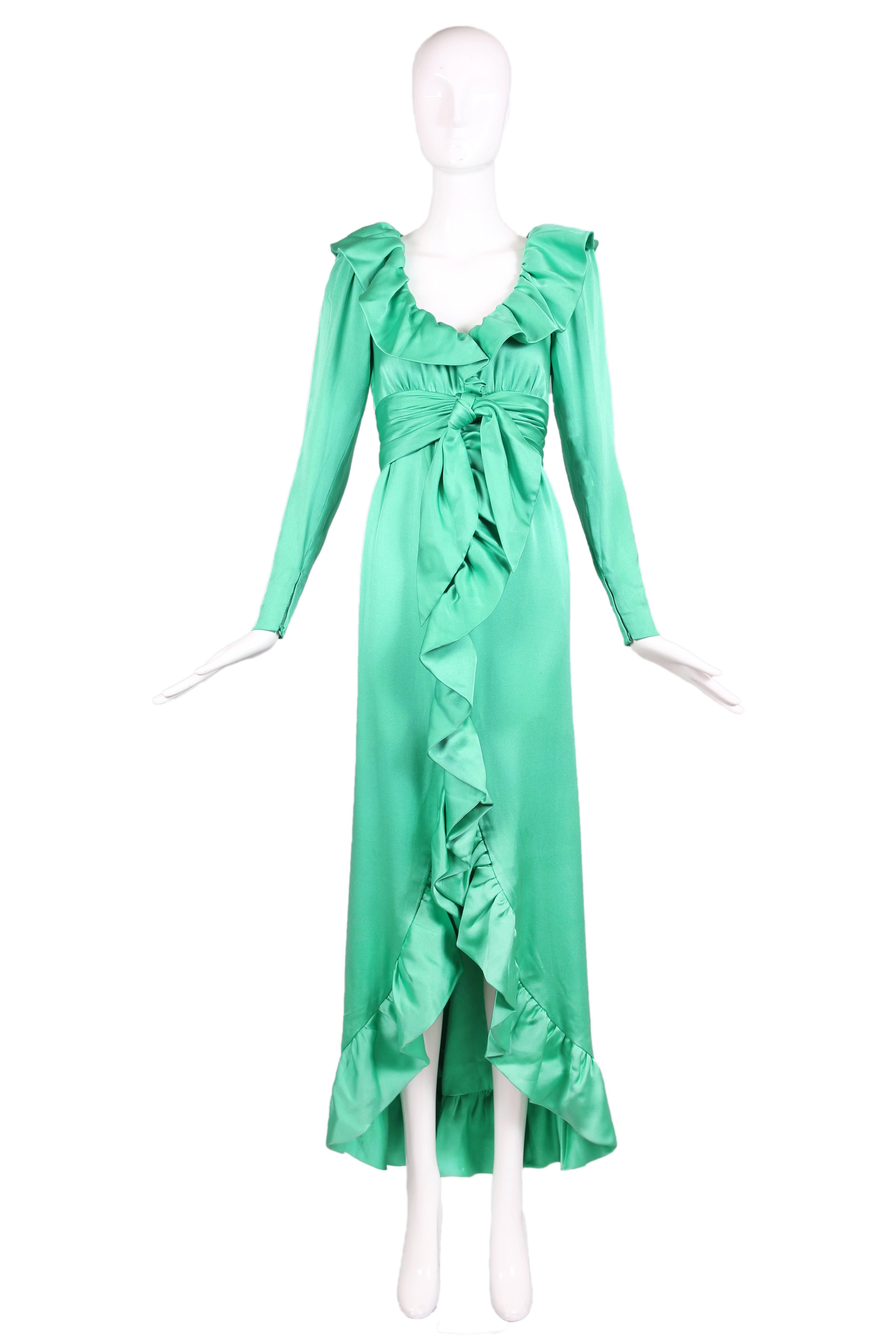 Vintage Givenchy haute couture sea foam green soft silk satin gown featuring  deep V-neckline with ruffle detail throughout. The dress has long sleeves and a waterfall hemline. Zipper closure at back. In excellent condition. 
MEASUREMENTS:
Bust -