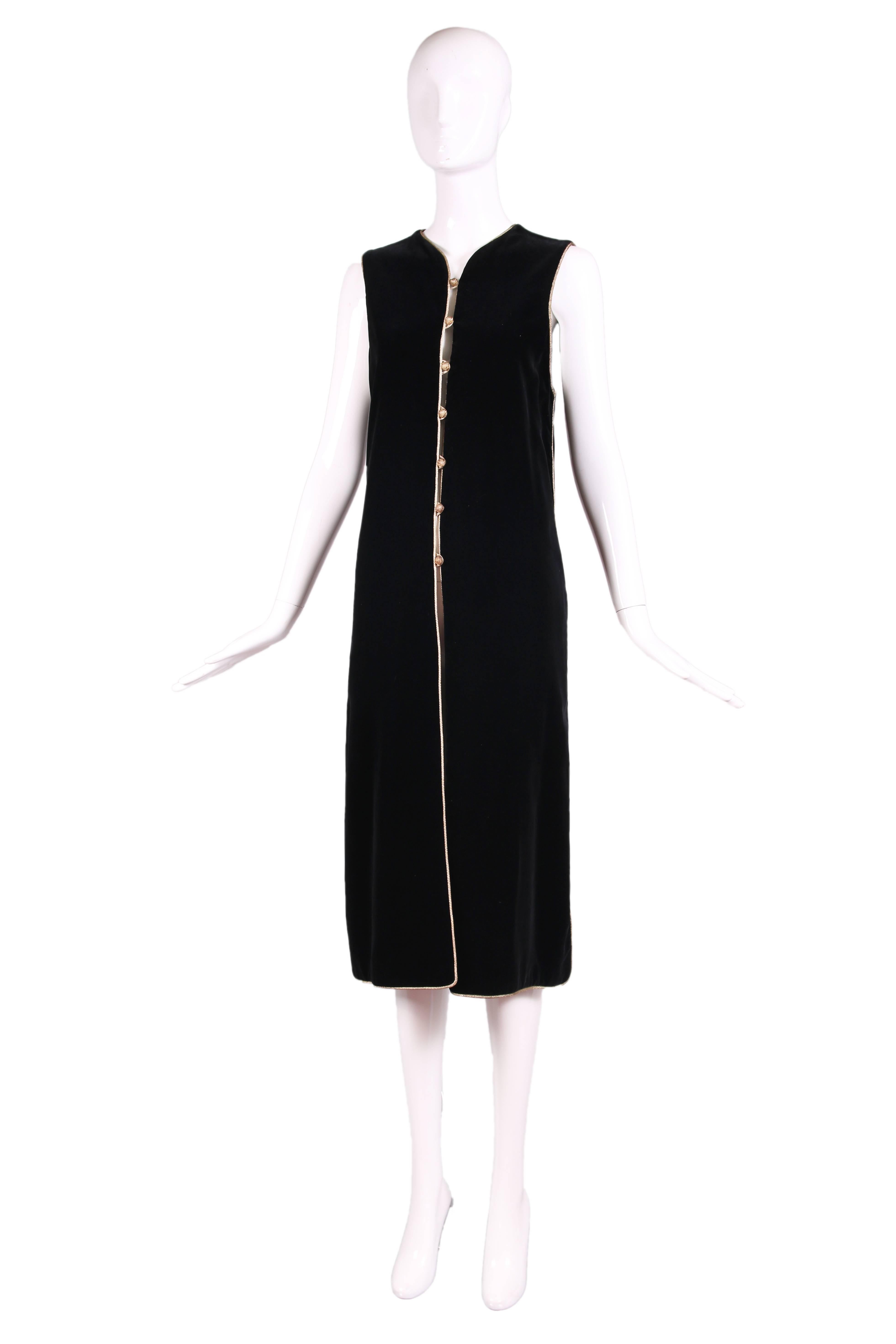 1976/1977 Yves Saint Laurent 'Opera - Ballets Russes' Collection black velvet tunic vest with gold lurex trim and button closure down center front. Slits on each side. Fully lined. In excellent condition. No size tag, please consult