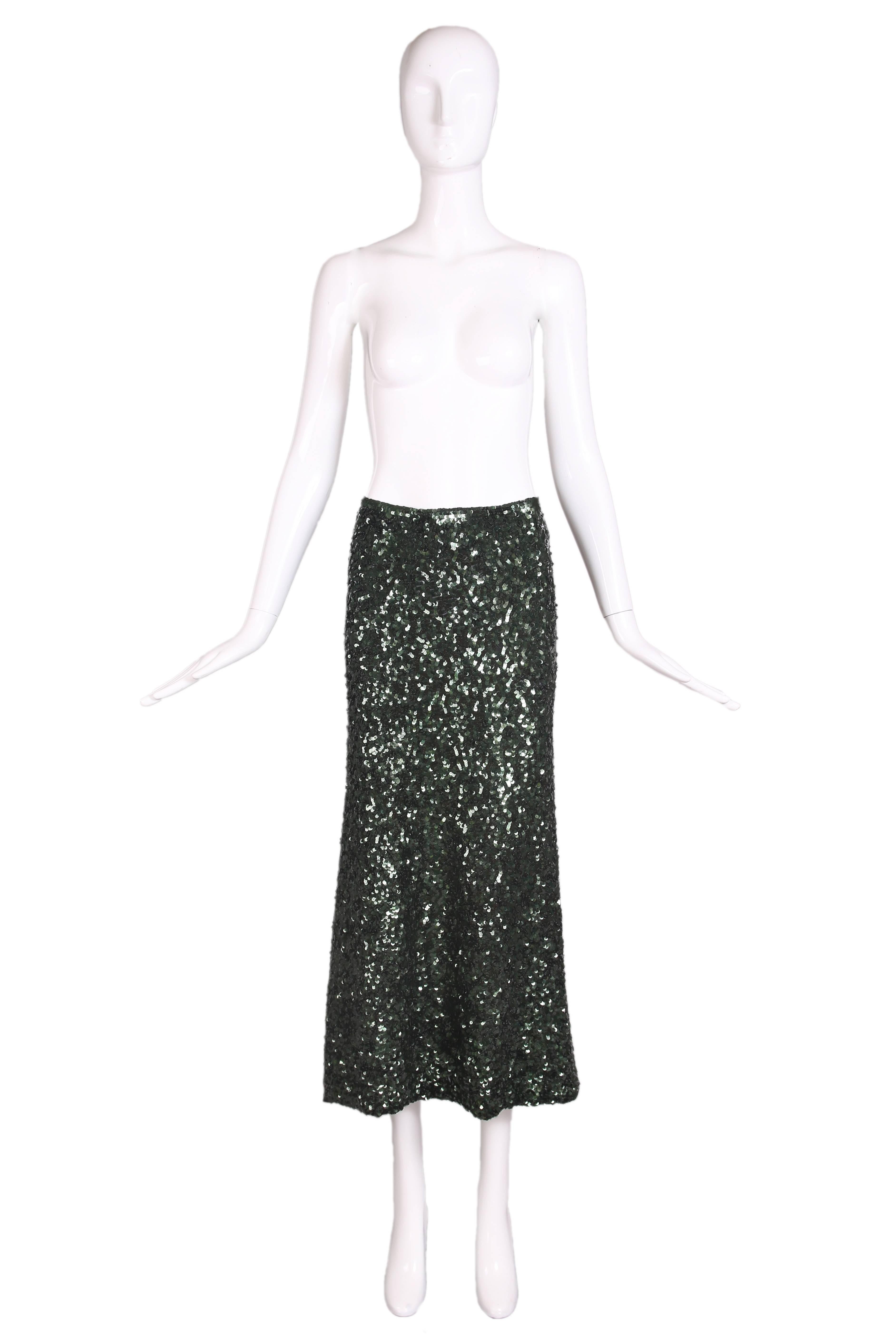 1990's Jean-Paul Gaultier dark green sequin a-line skirt in a stretch jersey fabric. The sequins overlap to form layers of swirls all over. Side zipper closure. In excellent condition. No size tag, please consult measurements.
MEASUREMENTS:
Waist -