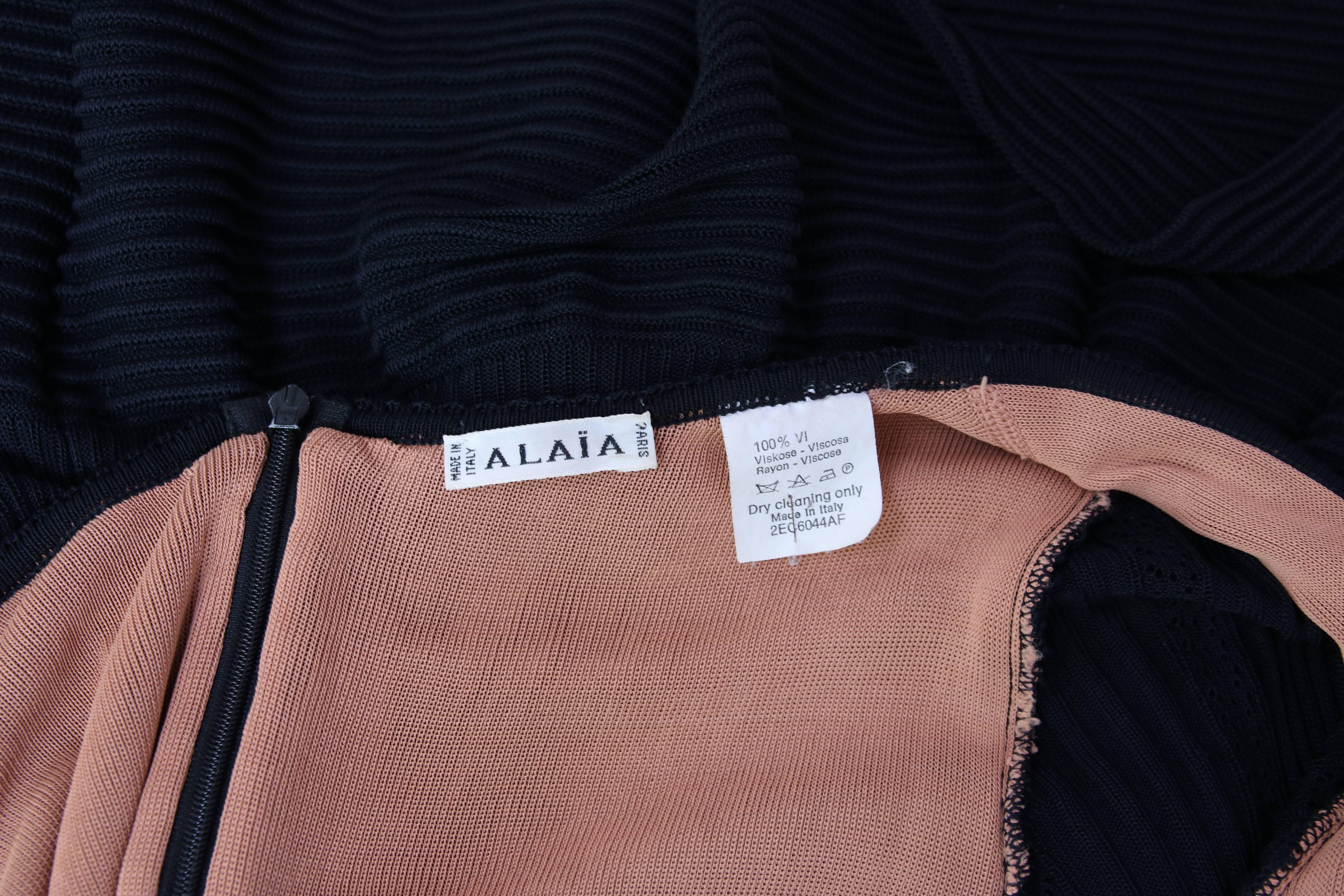 Alaia Black Sheer Stretch Viscose Long Sleeved Mini Dress W/Flounced Hem For Sale 1