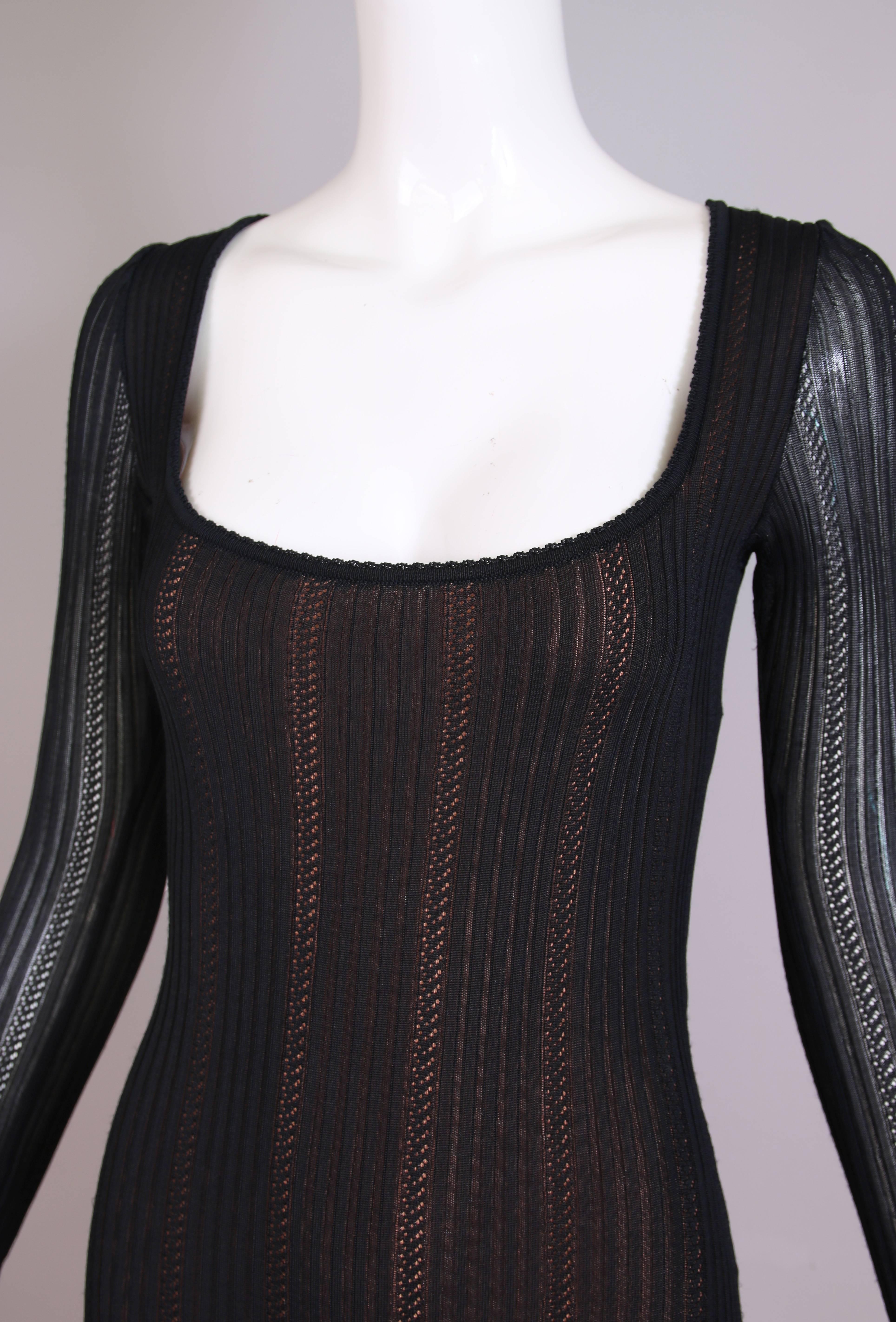Alaia Black Sheer Stretch Viscose Long Sleeved Mini Dress W/Flounced Hem In Excellent Condition For Sale In Studio City, CA