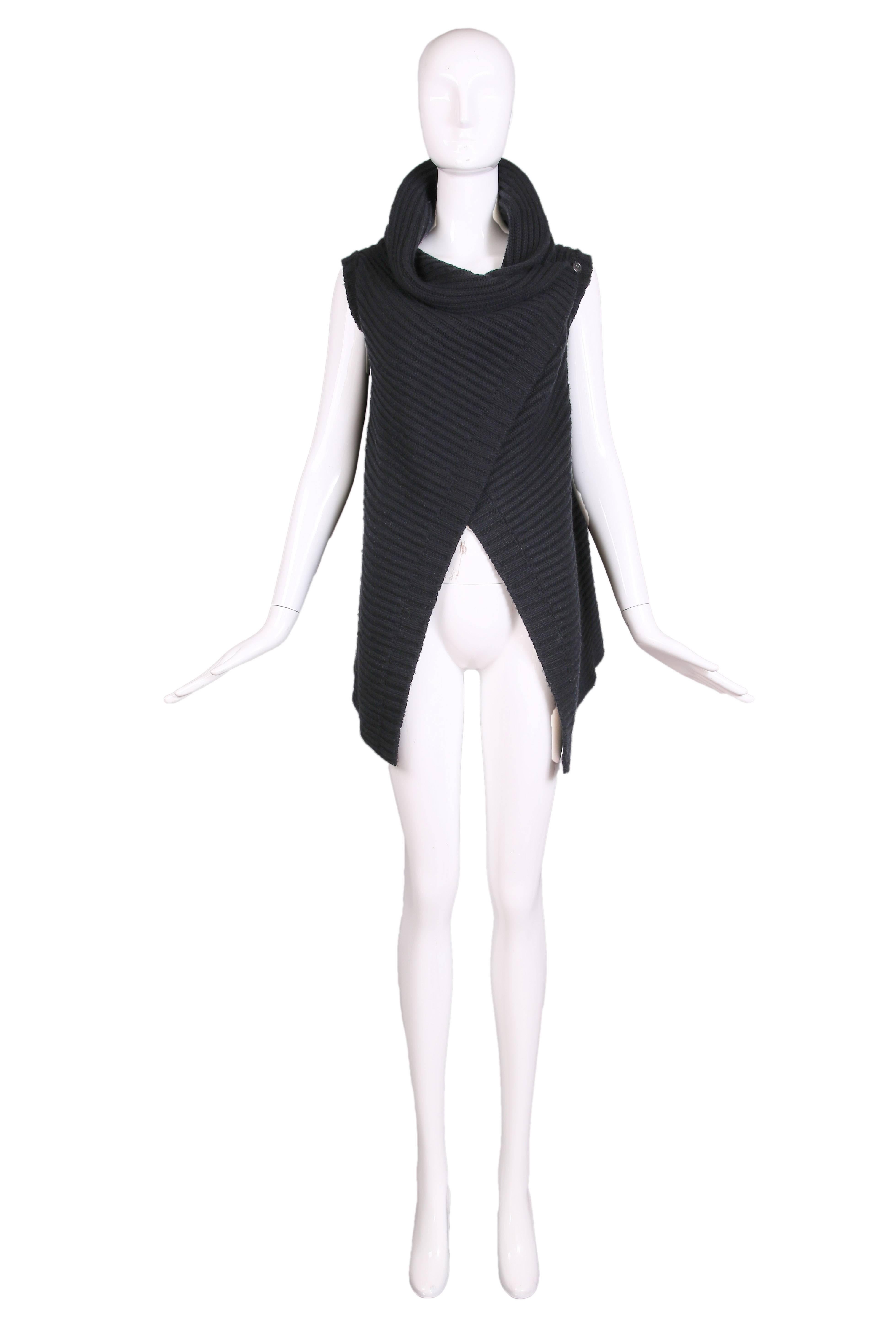 Jil Sander black cable knit wrap vest with oversized cowl neck collar and button closure at the left shoulder.  Excellent condition
Measurements -
Shoulder: 17"
Length: .5"31
Size: Small