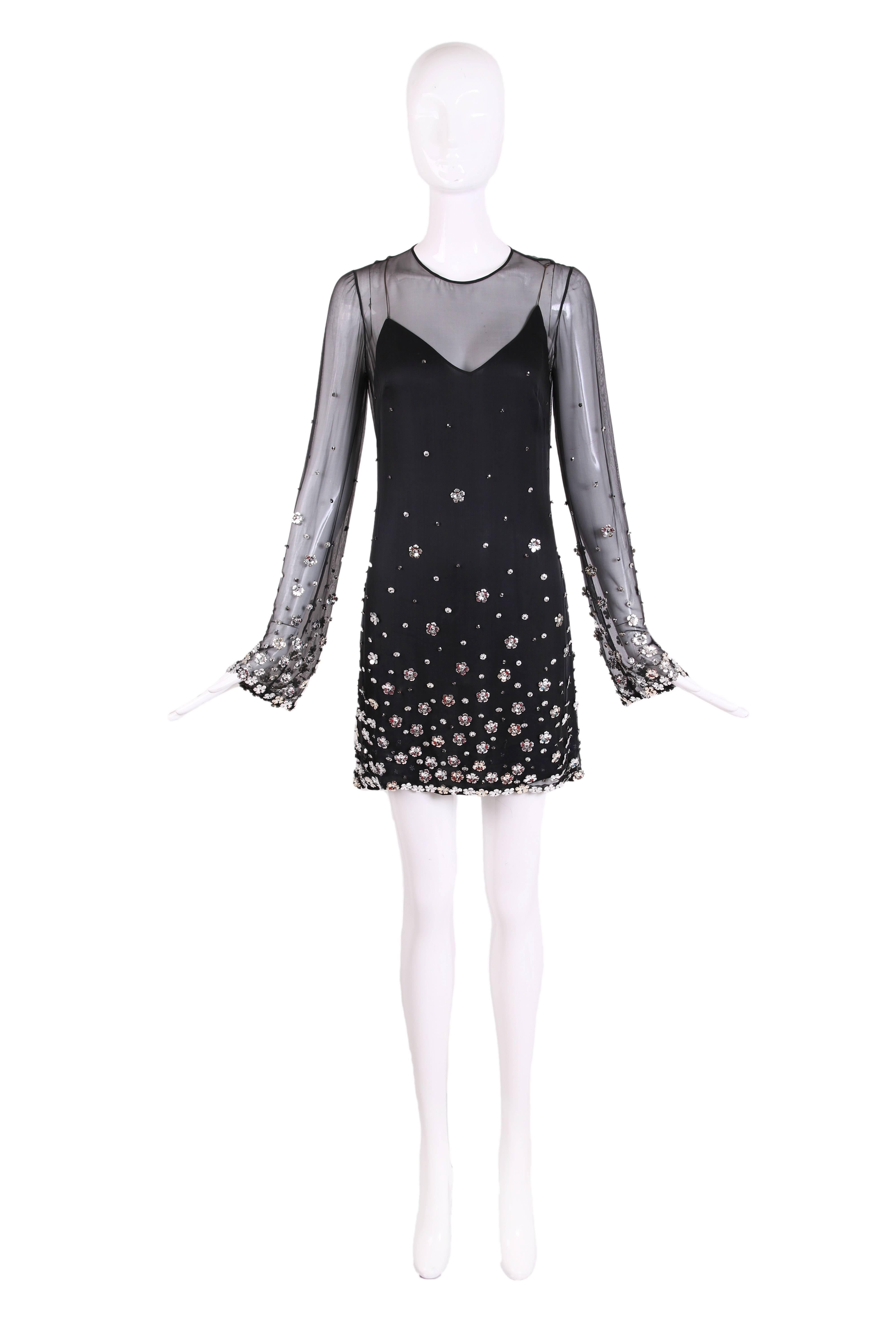 Loris Azzaro black silk chiffon long sleeve mini dress with flower paillette and bead detailing. There is a black under slip and back zip closures. This dress is made in France and is in excellent condition. 

Measurements:
Bust: 36