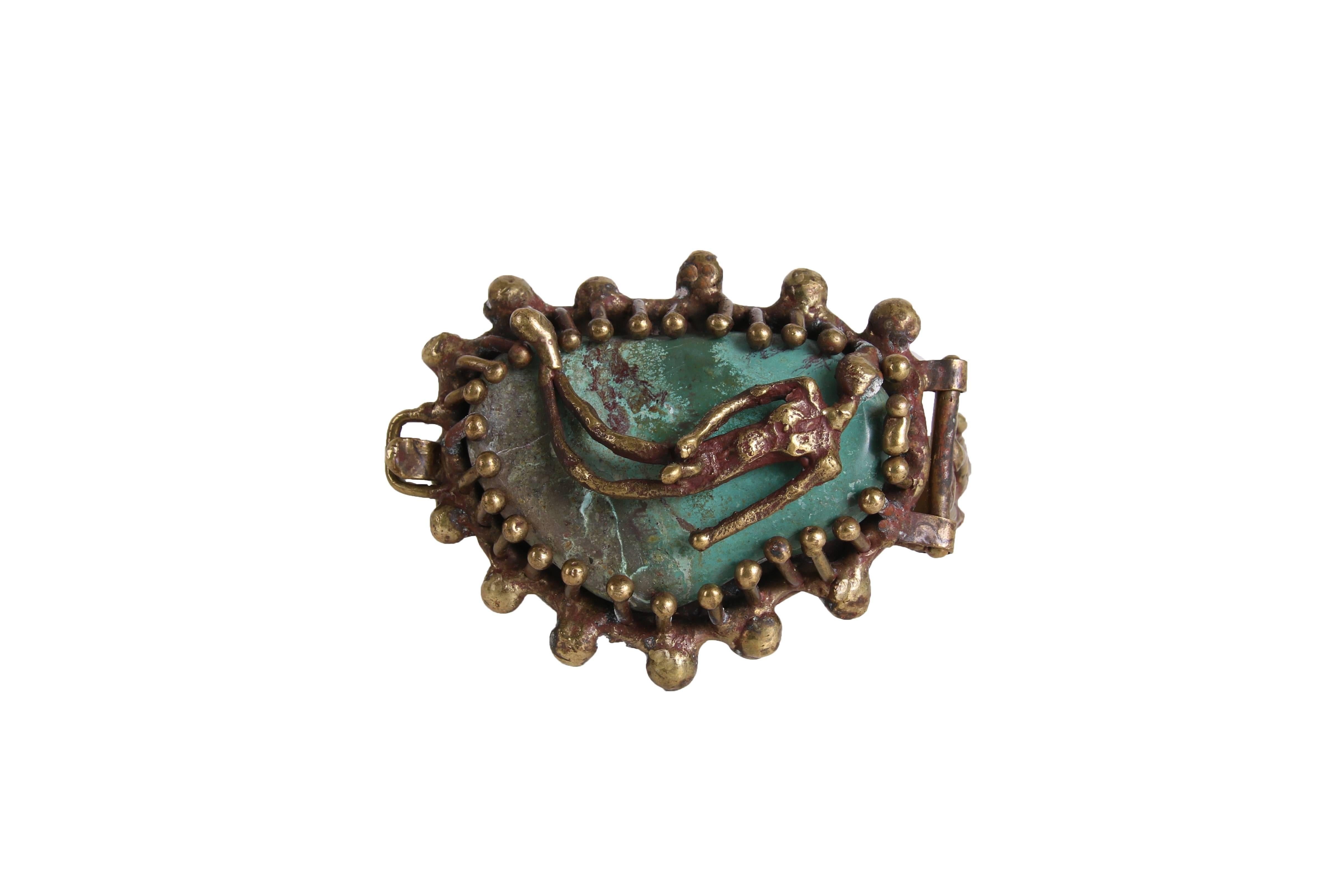 Pal Kepenyes brass hinged cuff bracelet with a figure over turquoise. In excellent condition -stamped 