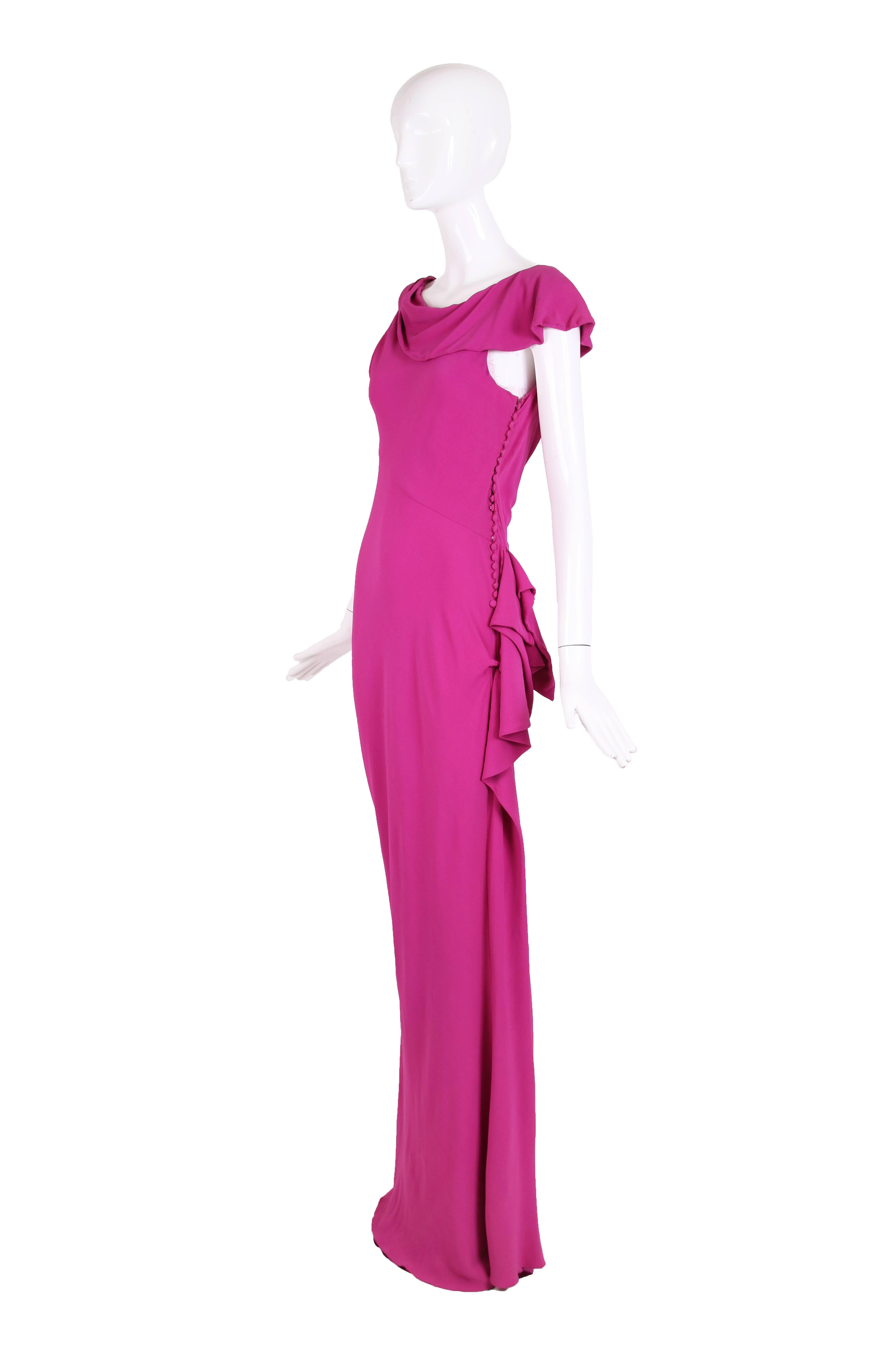 Christian Dior by John Galliano unlabeled bias-cut pink crepe evening gown with signature fabric button closure down the side, asymmetric neckline and decorative ruffle that begins at left hip and continues down side of the skirt. In excellent