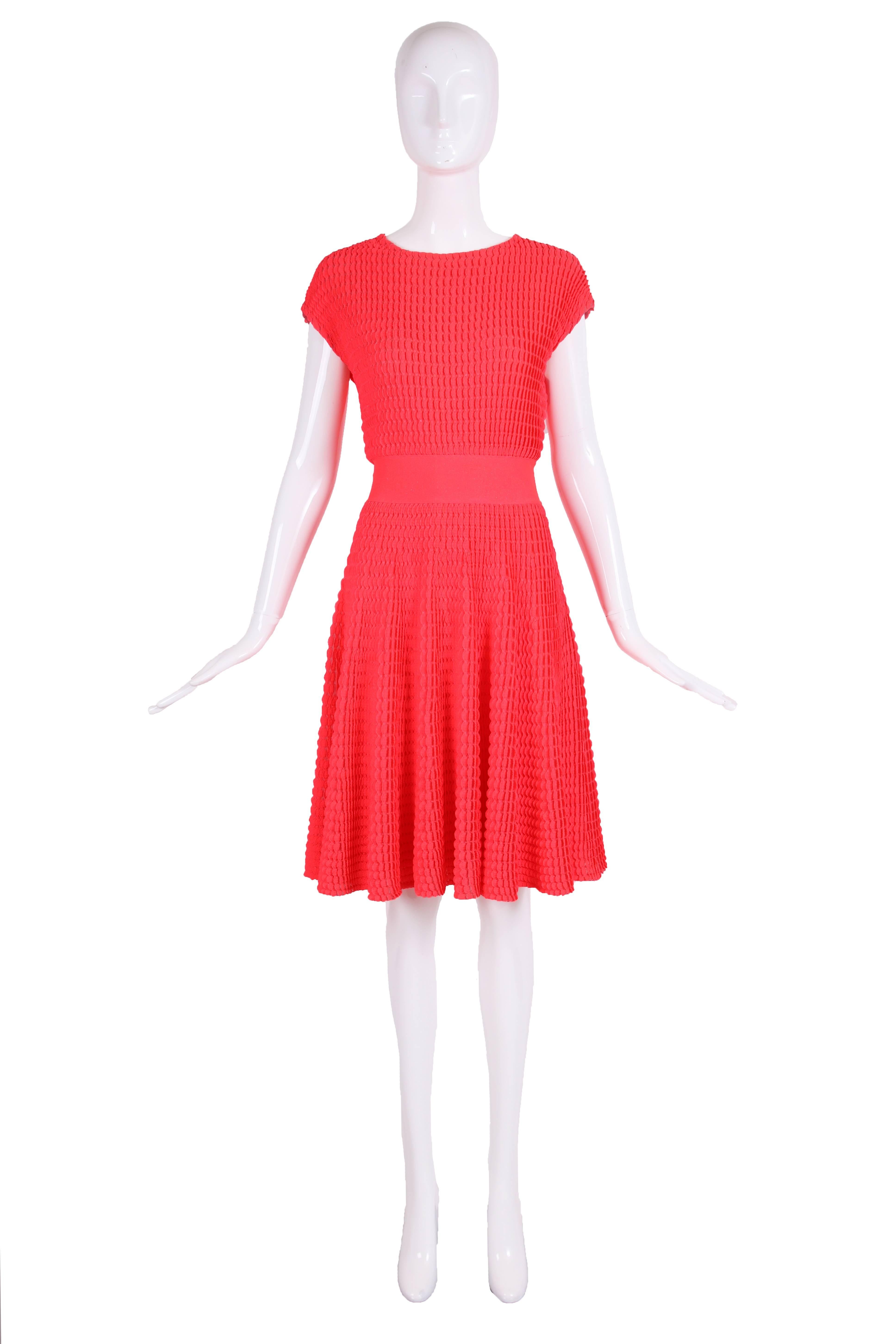 2013 Christian Dior by Raf Simons neon pink stretch cocktail or day dress with flair skirt. The fabric is textured - please see photos. In excellent condition - size tag 8.
MEASUREMENTS:
Bust - 36
