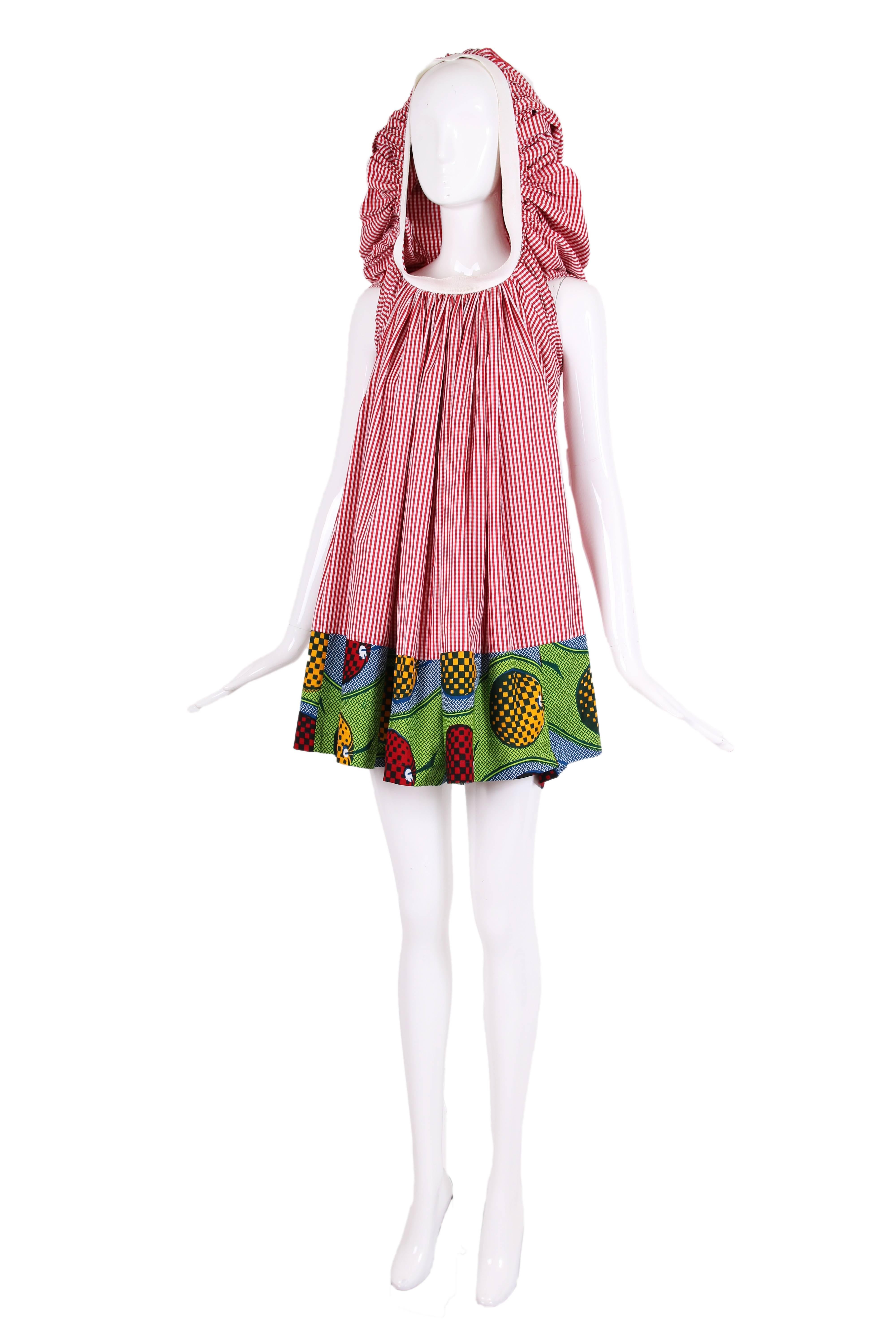 2007 Junya Watanabe for Comme des Garcons red and white checked sleeveless cotton blend day dress with oversized hood that can also be worn as an asymmetric collar. The band at the hem is printed with multi-colored checkered fruit. In excellent
