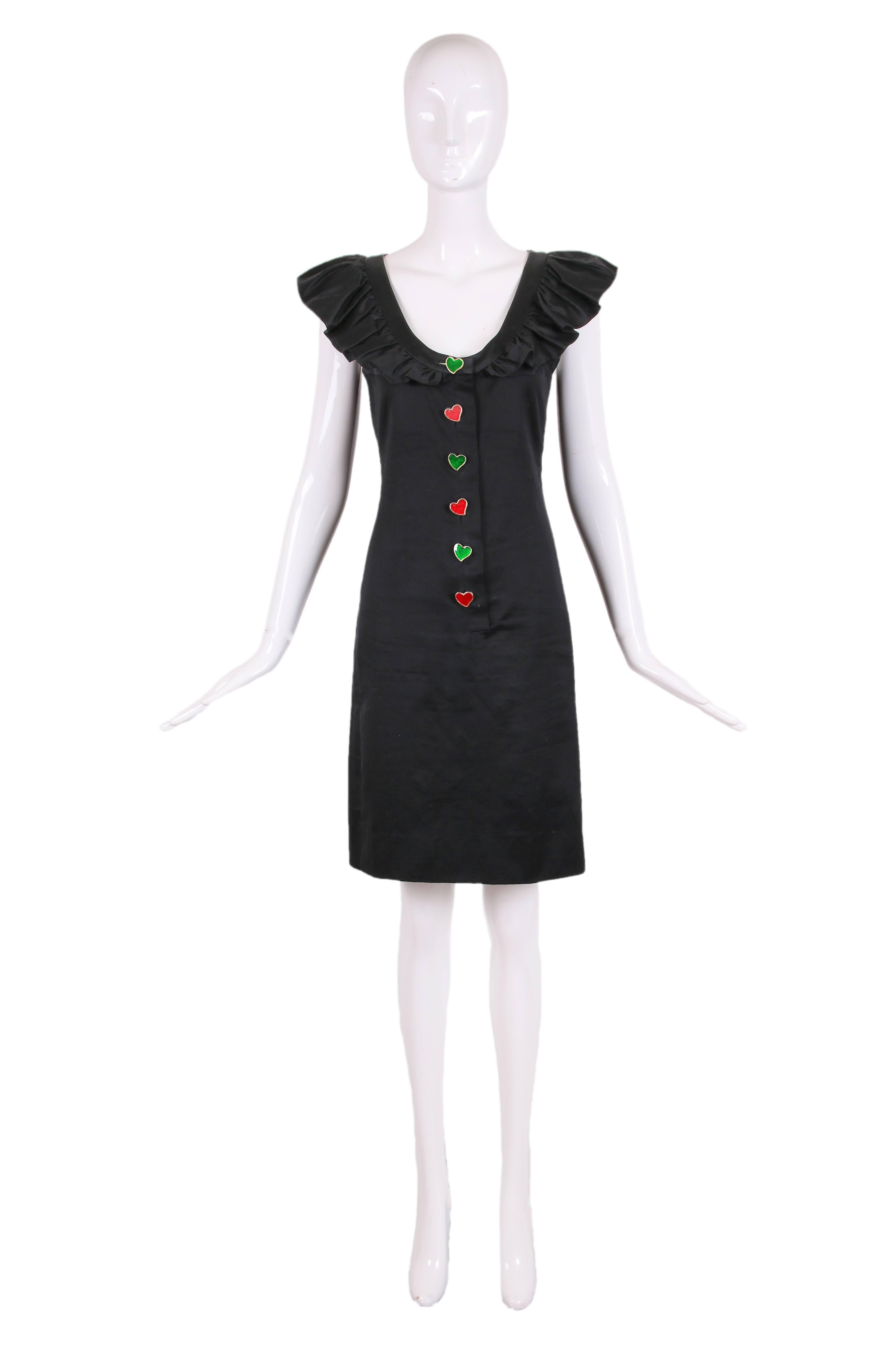 1990's Yves Saint Laurent black knee-length day dress with a ruffled neckline and metal heart-shaped button closures at bodice front - please see original AD in the photo selection for this item. The buttons alternate between sparkling/metallic red