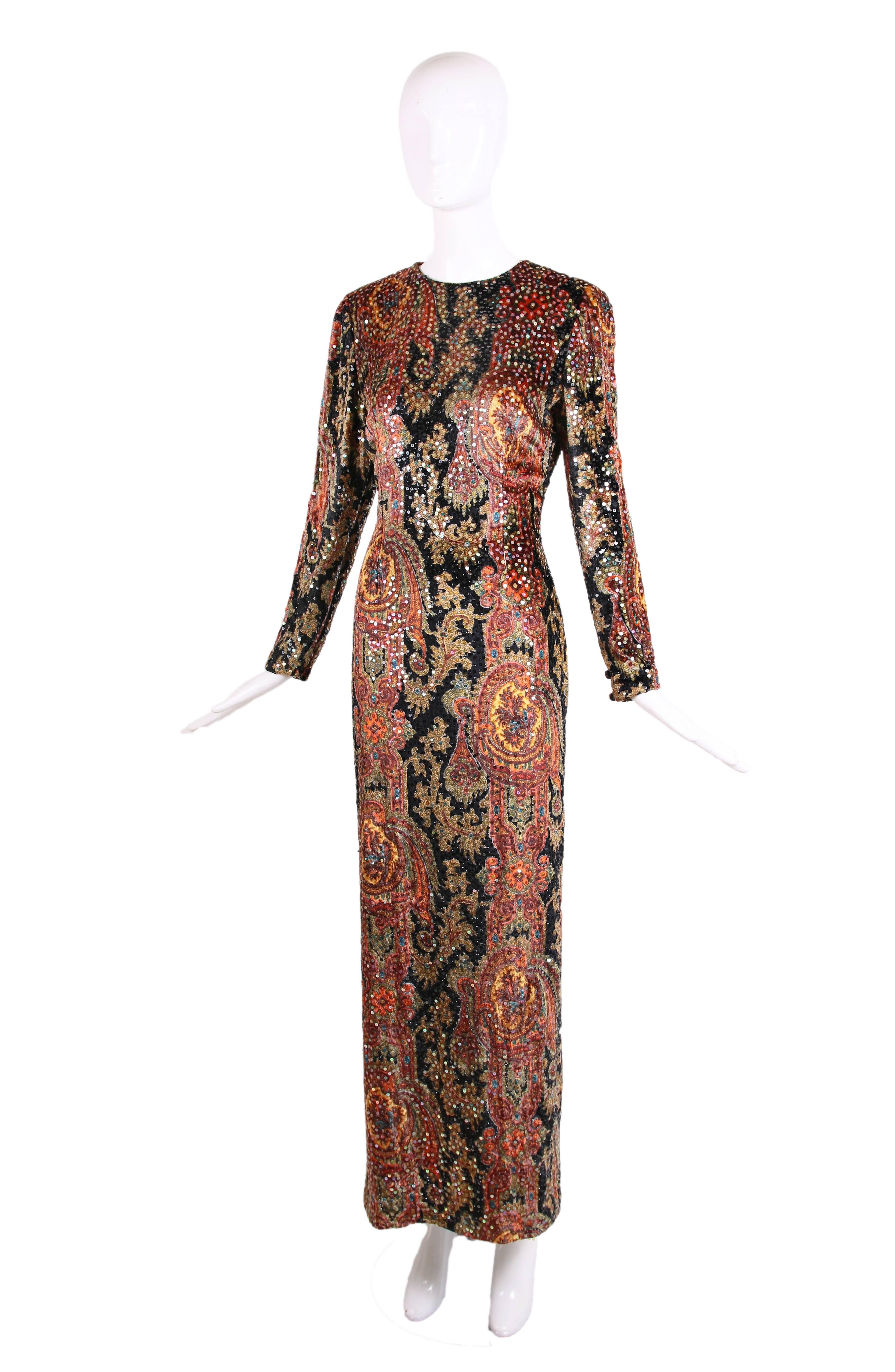 Bill Blass silk velvet long sleeved evening gown with sequins and paisley print. In excellent condition - no size tag so please consult measurements. Most likely this gown will fit a size 4 or a small 6 but again, consult measurements.