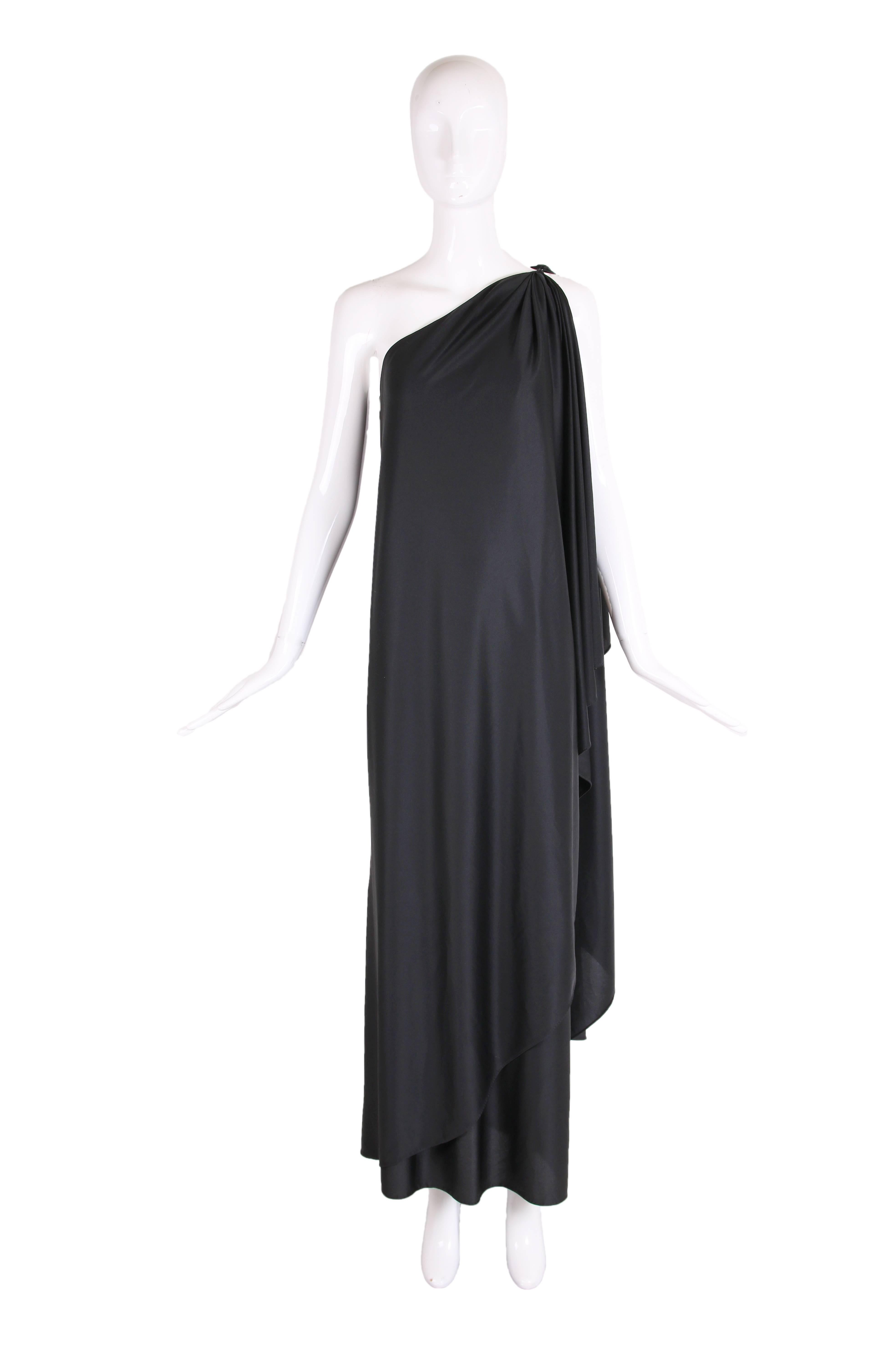 1979 Halston IV black single shoulder Dorian gown with draped panels at back and front. There is no fabric tag but it feels like a jersey or a jersey blend or a silk jersey - these are just guesses. In excellent condition. Please consult