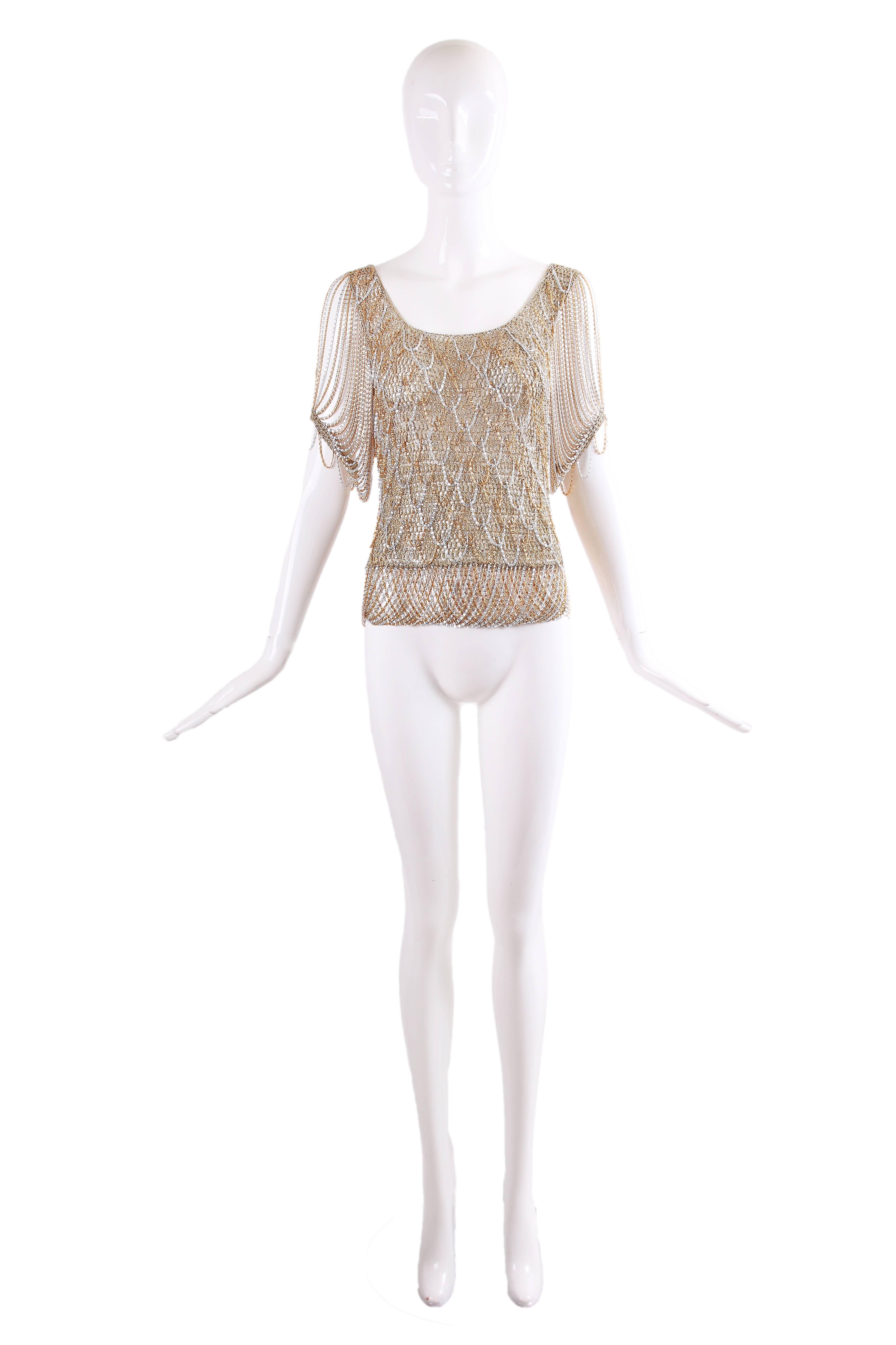 1970's Loris Azzaro gold and silver knit lurex top with chain fringe at sleeves, hem and knit into the lurex at the bodice. In excellent condition - no size tag, please consult measurements.
