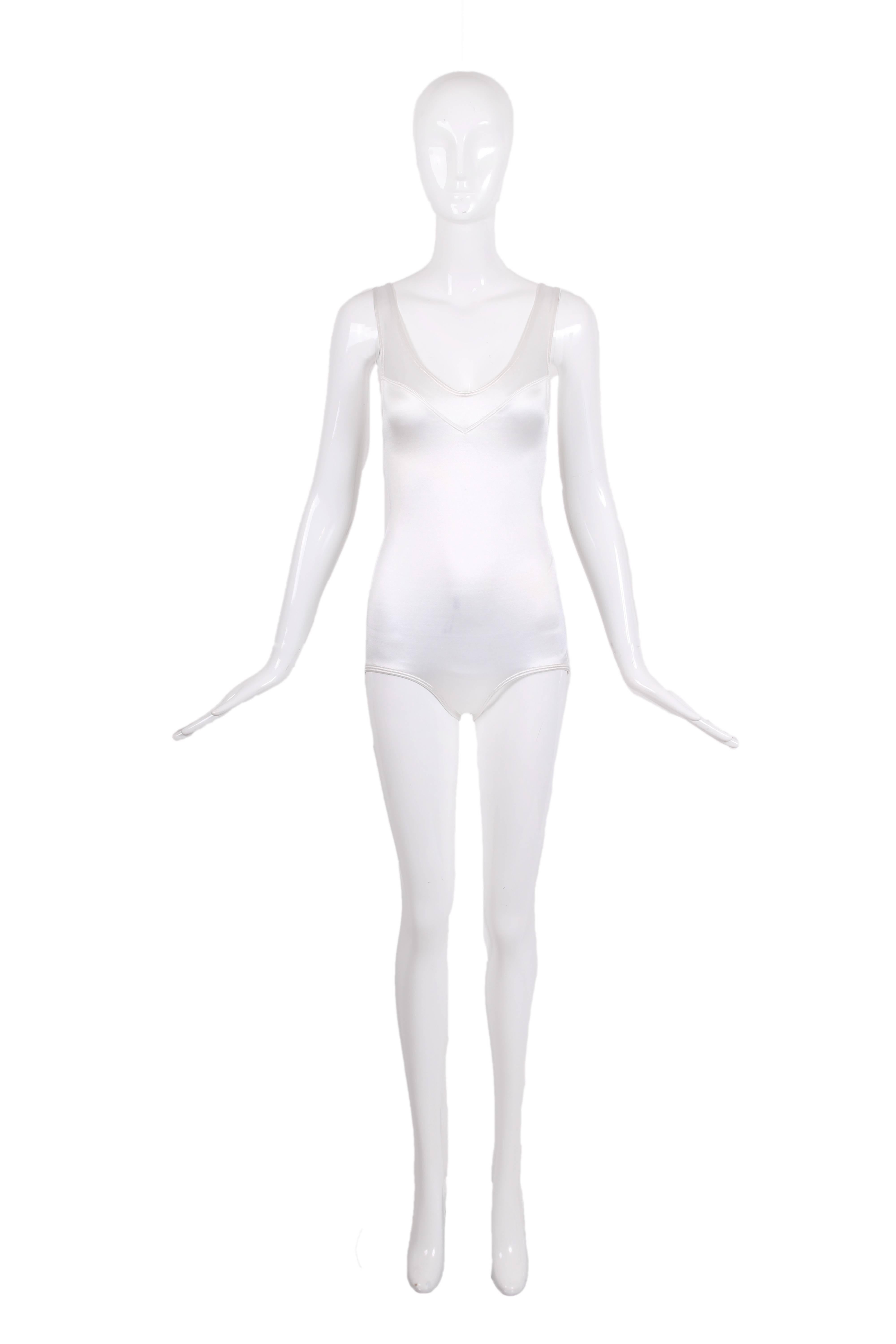 Vintage Alaia white nylon and stretch bodysuit with V-neckline and a satin sheen. In excellent condition with very light marks at interior near arm hole. Size XS with a lot of stretch.
MEASUREMENTS:
Length - 27