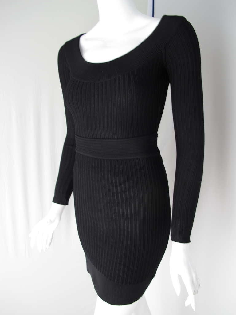 This Alaia ensemble is for the woman who is comfortable looking sexy AND chic at the same time. The body hugging ensemble is comprised of a skirt and a body suit top that snaps closed. In very good to excellent condition. The top is a size Medium