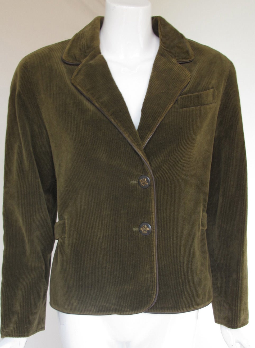 A vintage Hermes olive green corduroy jacket with leather piping and Hermes metal 