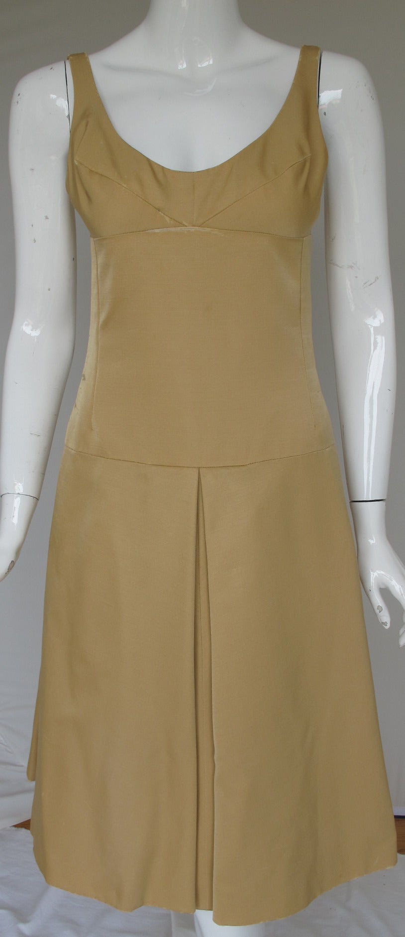 A spectacular 1960 Marguery Bolhagen ensemble comprised of a champagne-colored silk faille dress and matching over-jacket/bolero. The dress came from the Brooklyn Museum de-accession and once belonged to Austine McDonnell Hearst - Mrs. William