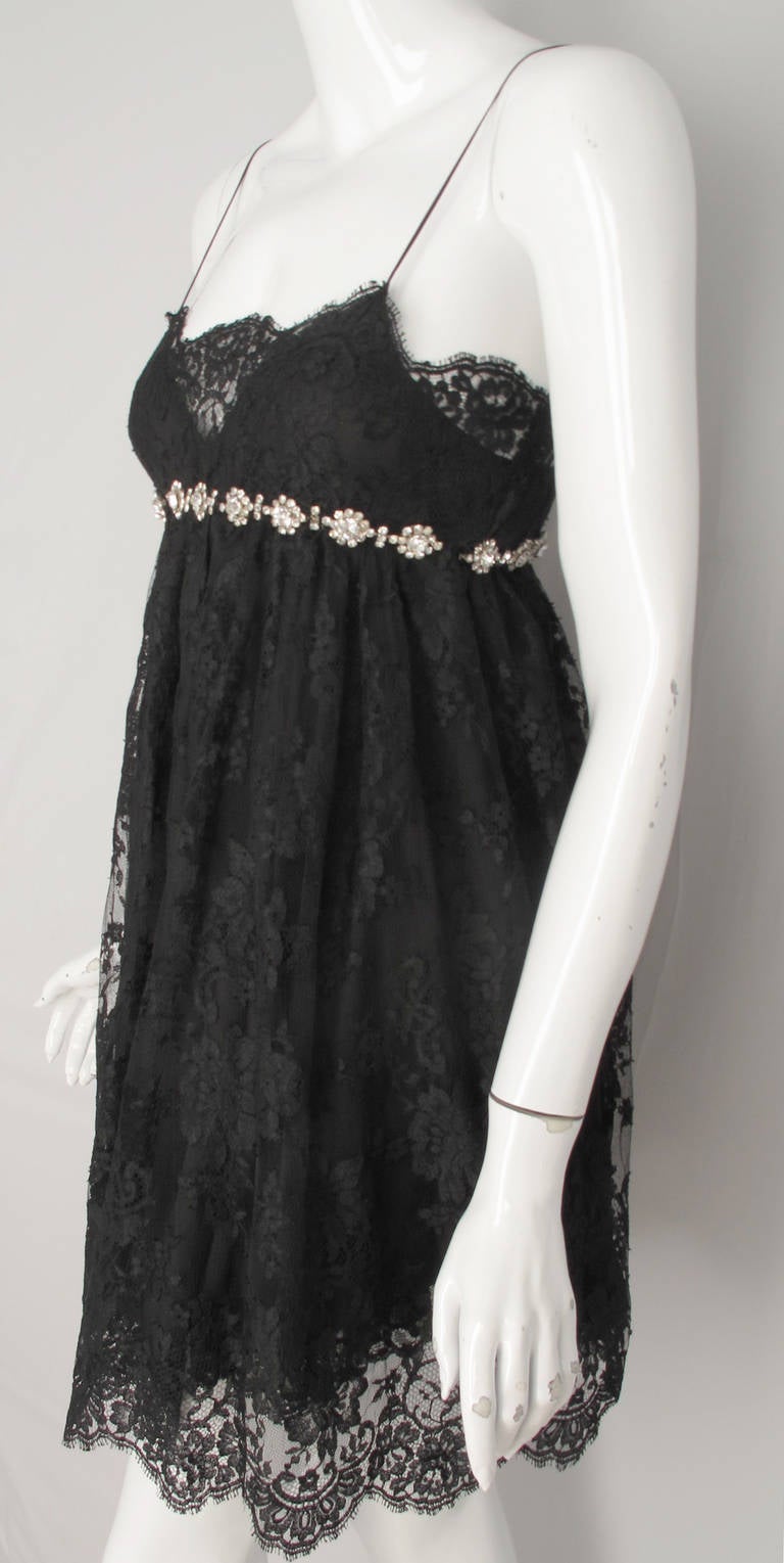You can never go wrong with a baby doll dress, especially a super sexy Dolce & Gabbana baby doll dress. This super chic dress features three layers of fabric, two under layers of either silk or silk blend black chiffon with a black lace overlay at
