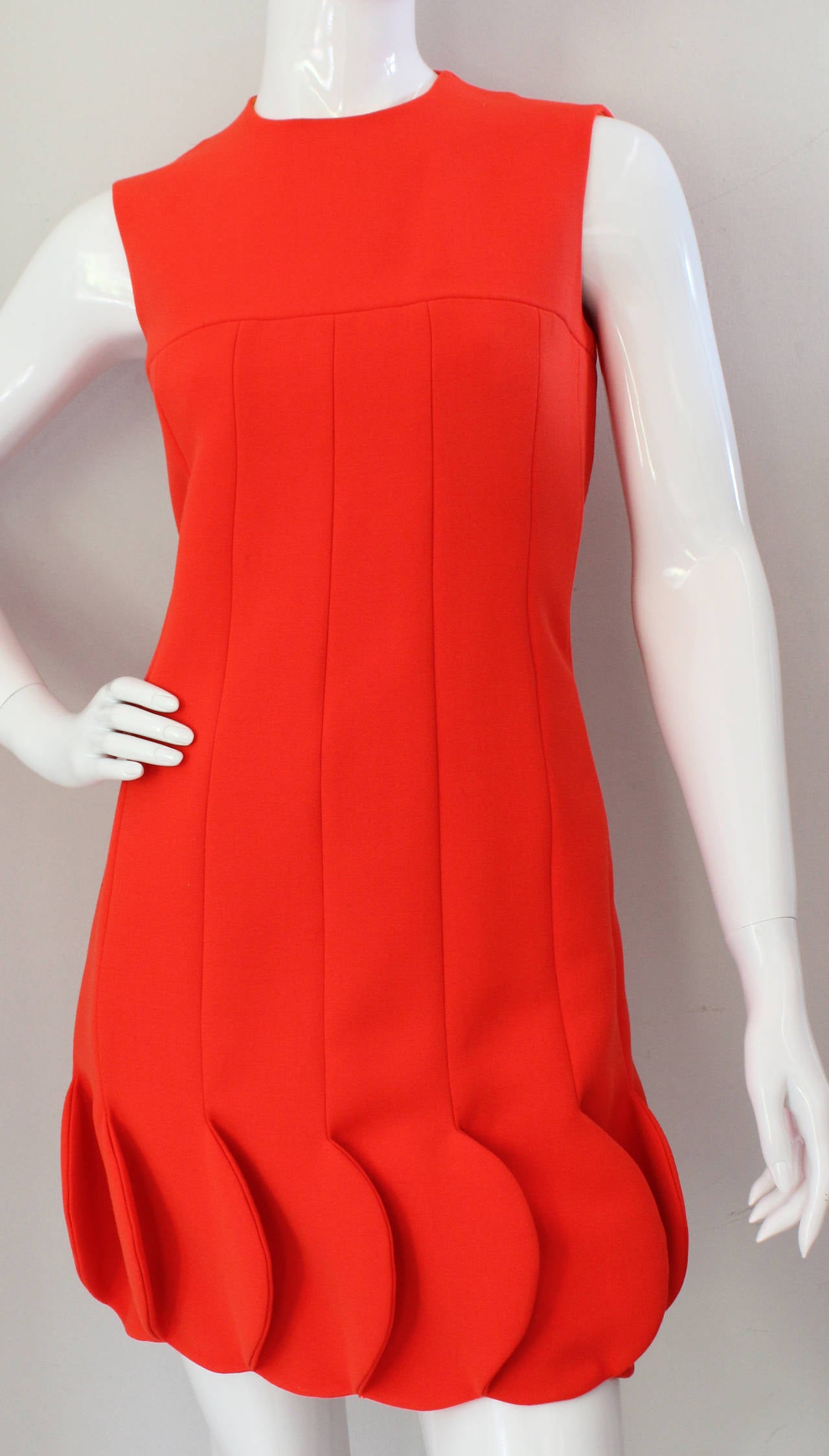 This circa 1968 Pierre Cardin bright orange wool sleeveless dress with petalled or 