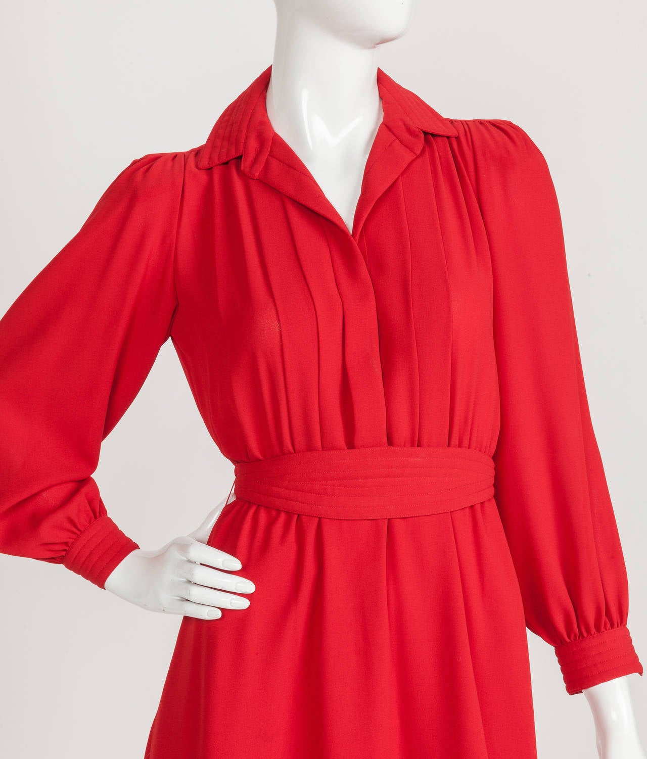 I have a special place in my heart for the secretary dress and this 1980's Pierre Cardin secretary dress in shade of bright red is no exception. I love the channel stitched design motif at the collar, sleeves and cumberbund-like tie sash at the