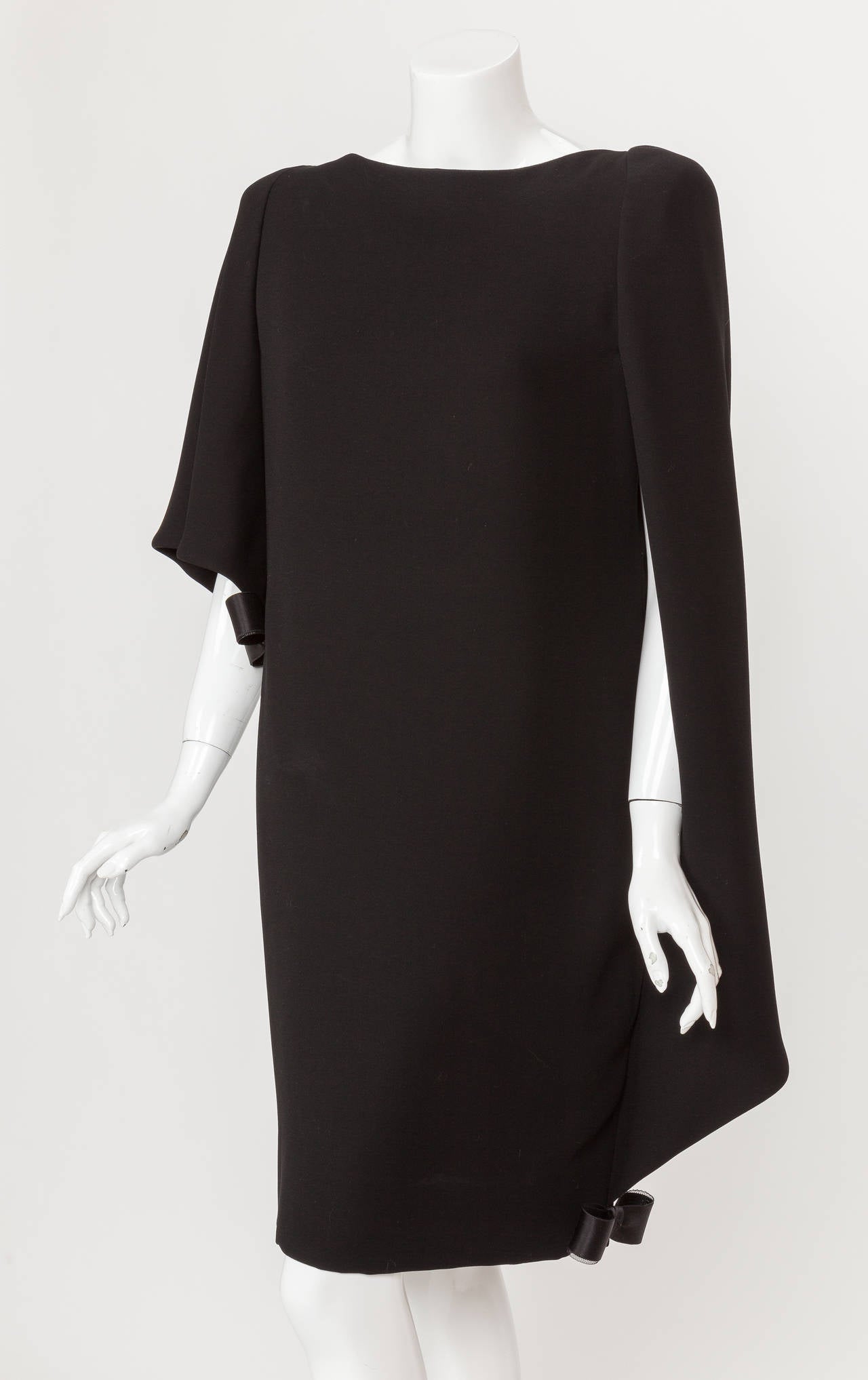 A circa 1992 Pierre Cardin haute couture black silk asymmetric cocktail dress with attached cape. This is absolutely one of the most beautiful garments I've ever seen and it is a masterclass in exquisite haute couture tailoring technique. The