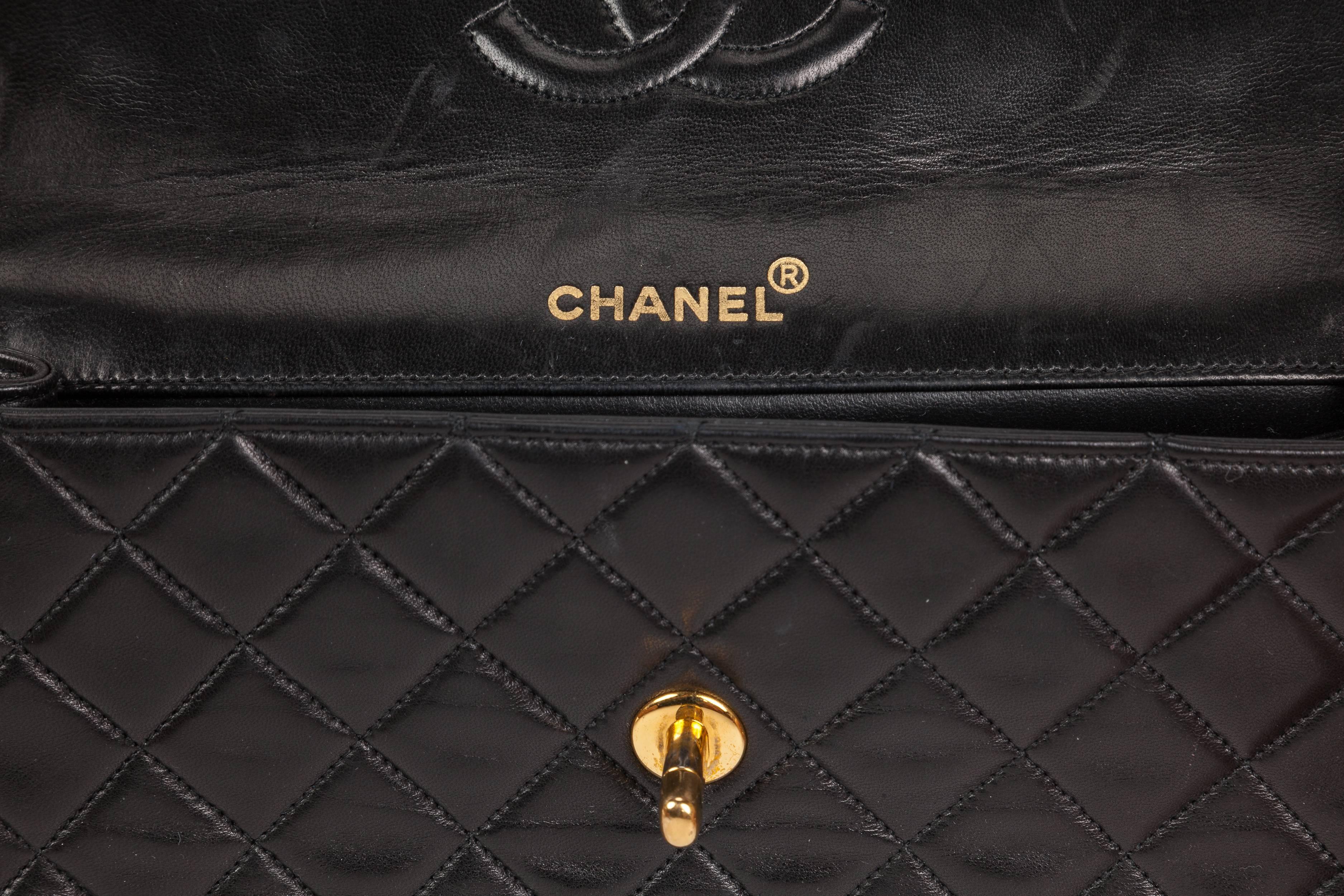 quilted black purse with gold chain